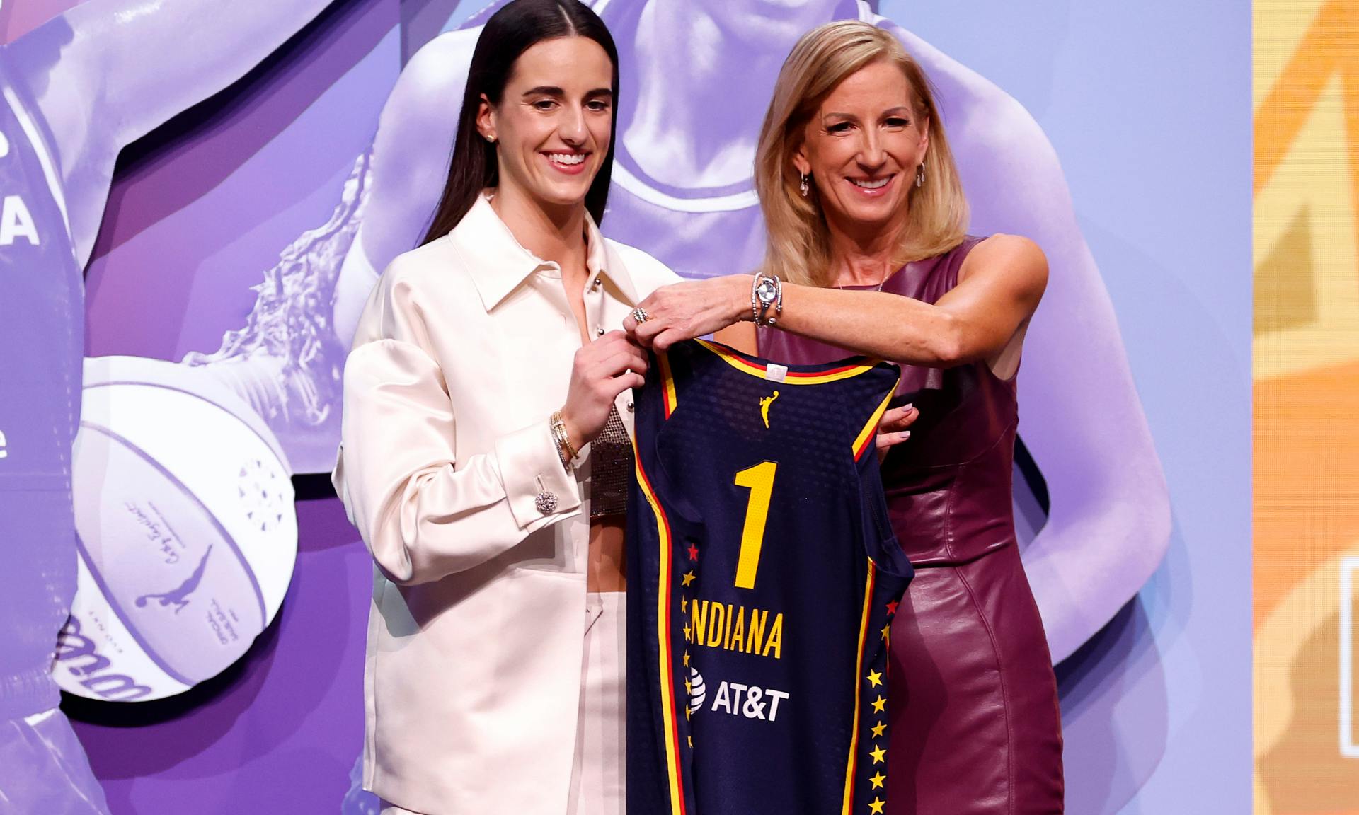 Caitlin Clark poses with WNBA Commissioner Cathy Engelbert after being selected first overall pick by the Indiana Fever