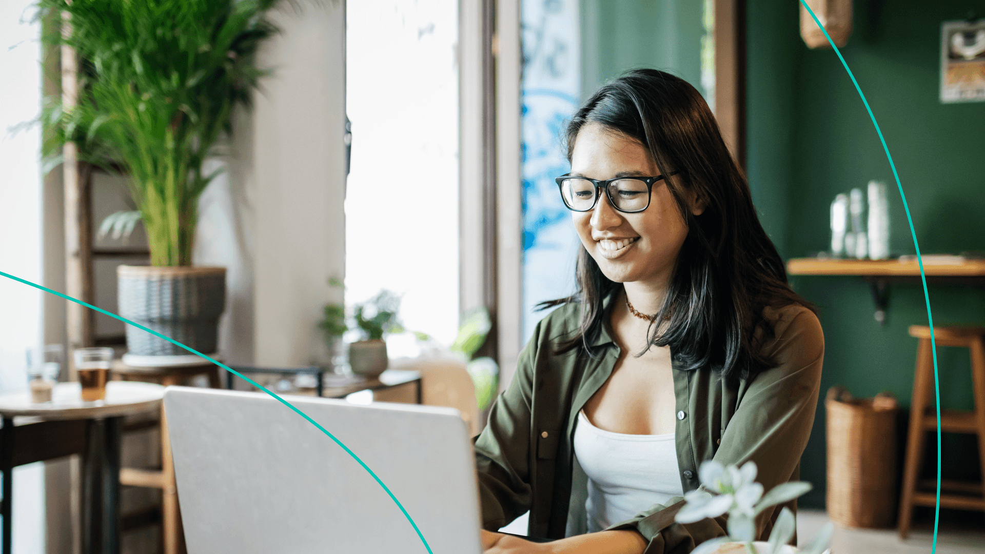 Woman smiling at computer.