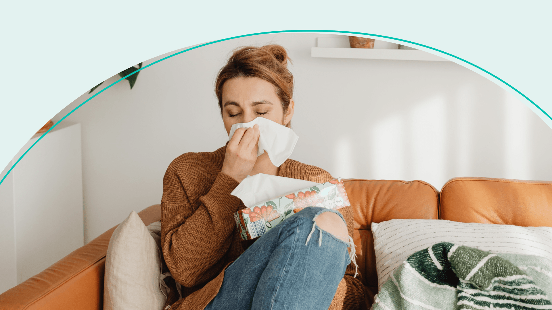 A woman blowing her nose