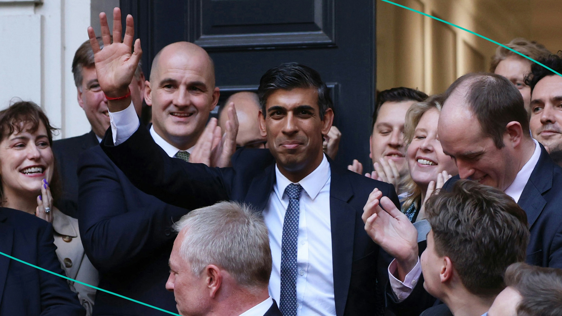 New Conservative Party leader and incoming prime minister Rishi Sunak (C) waves as he is greeted by colleagues at the Conservative Party Headquarters after having been announced as the winner of the Conservative Party leadership contest on October 24, 2022