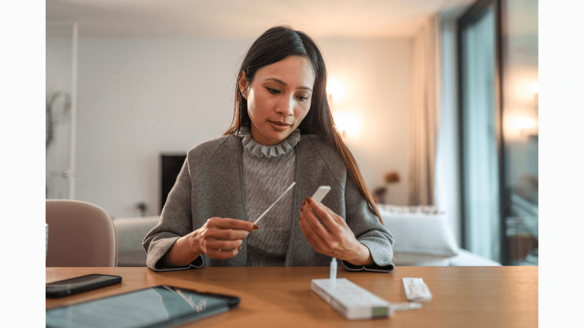 Woman taking at-home COVID-19 test.