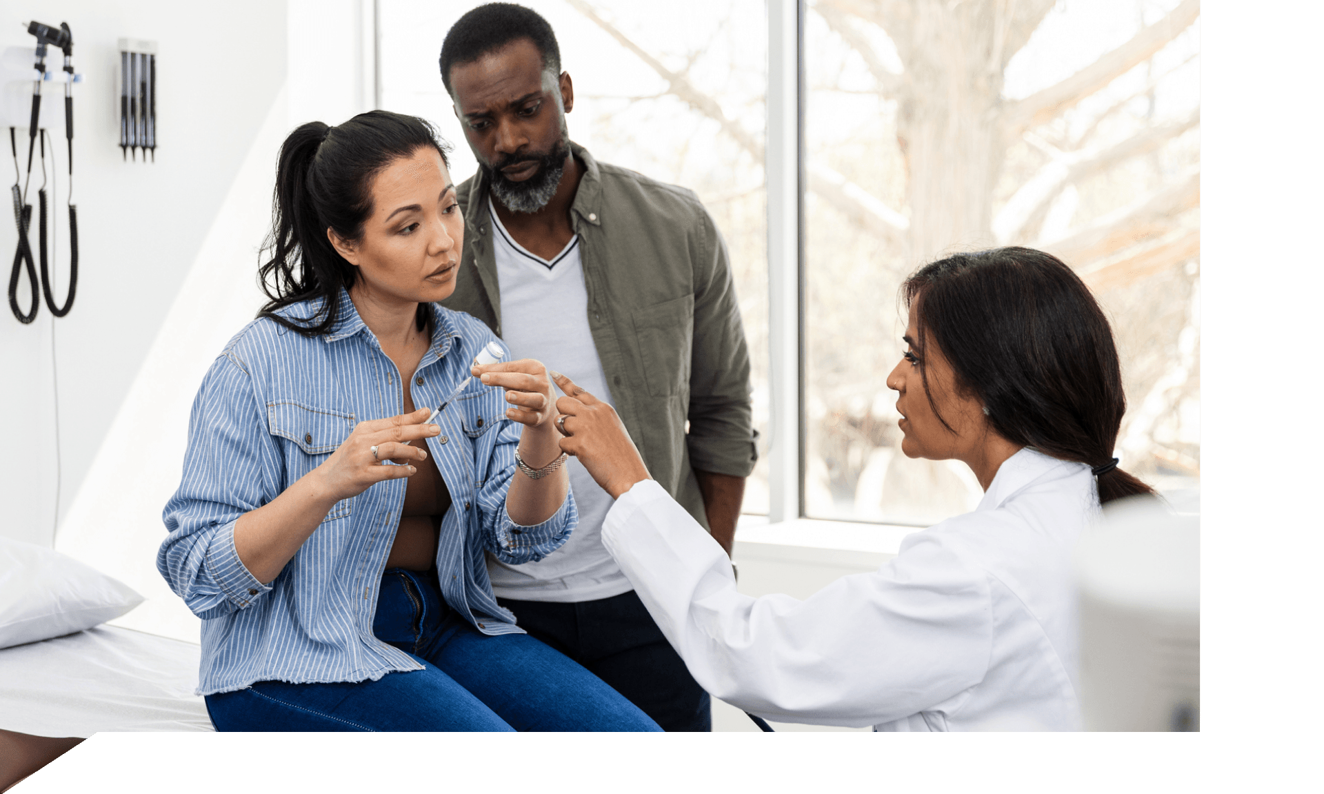 Two people with their doctor about fertility treatments 