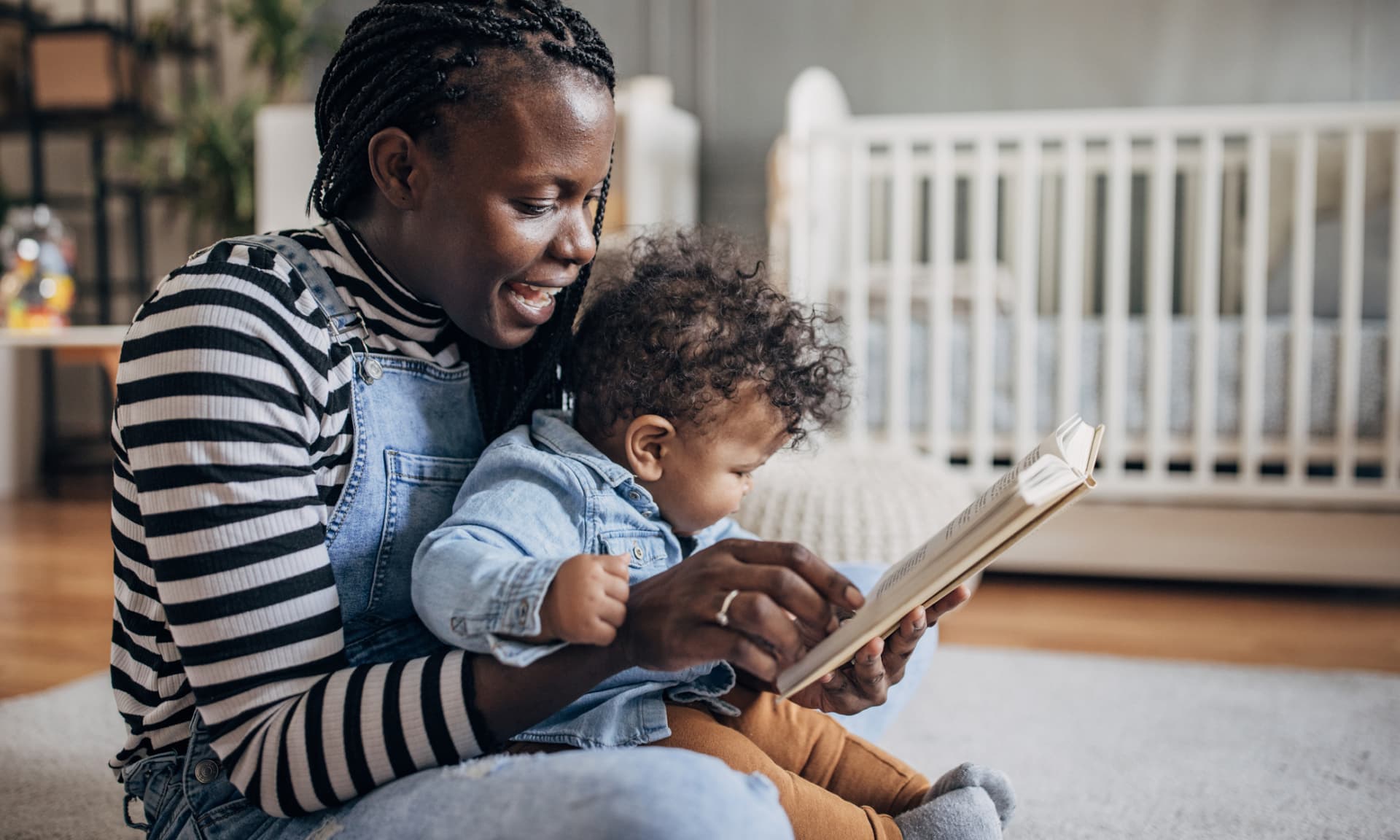 mom reading to baby