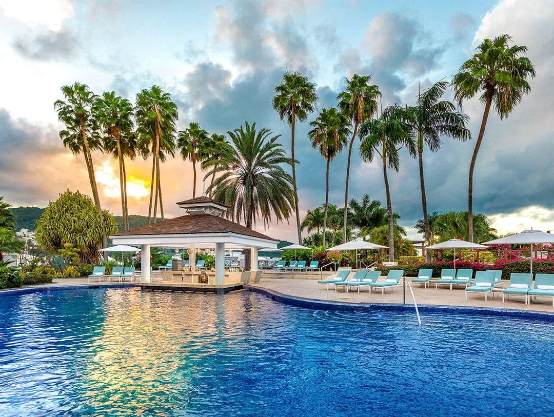 A resort looking over a pool 