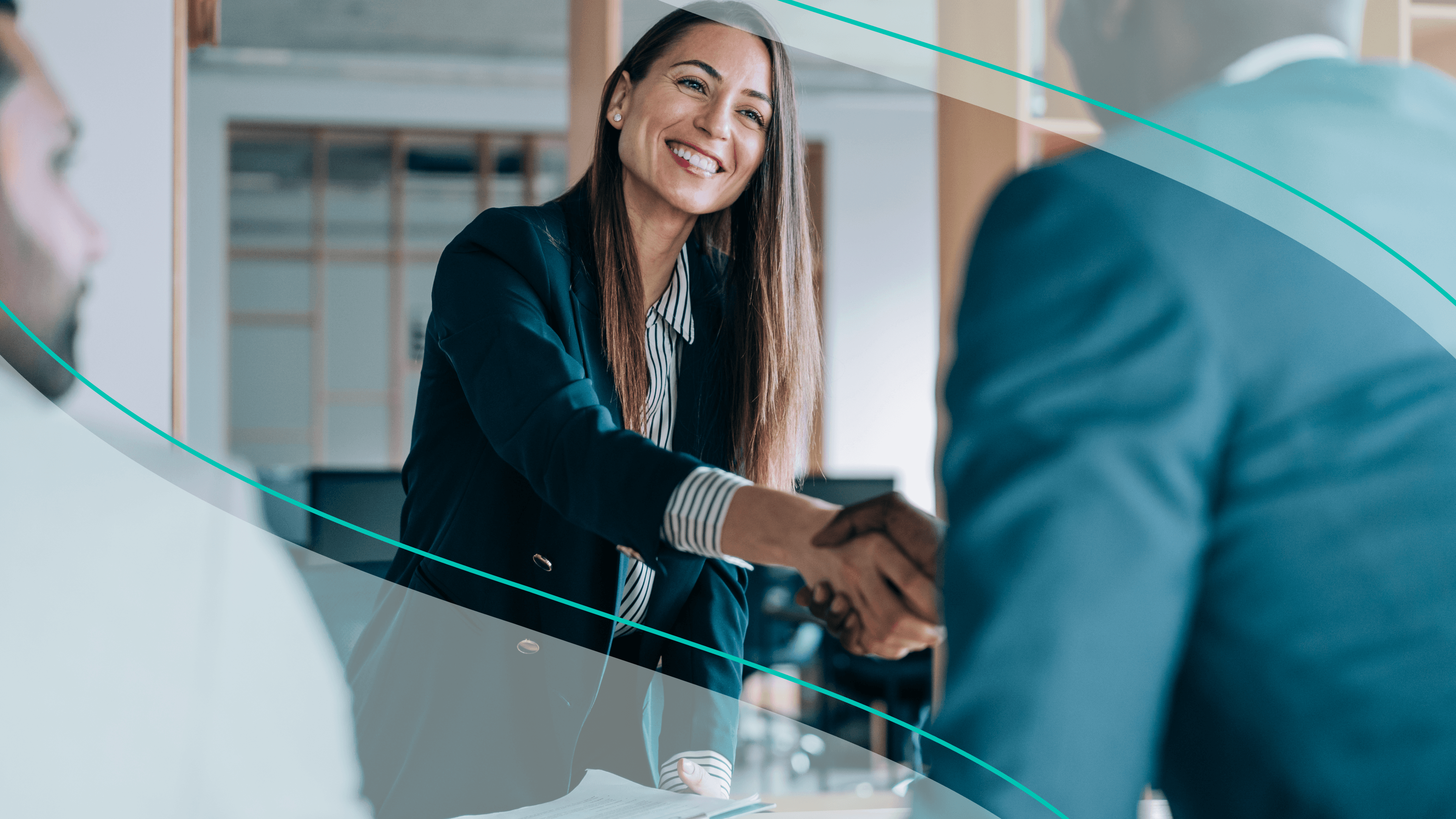 Woman smiles and shakes hands with man