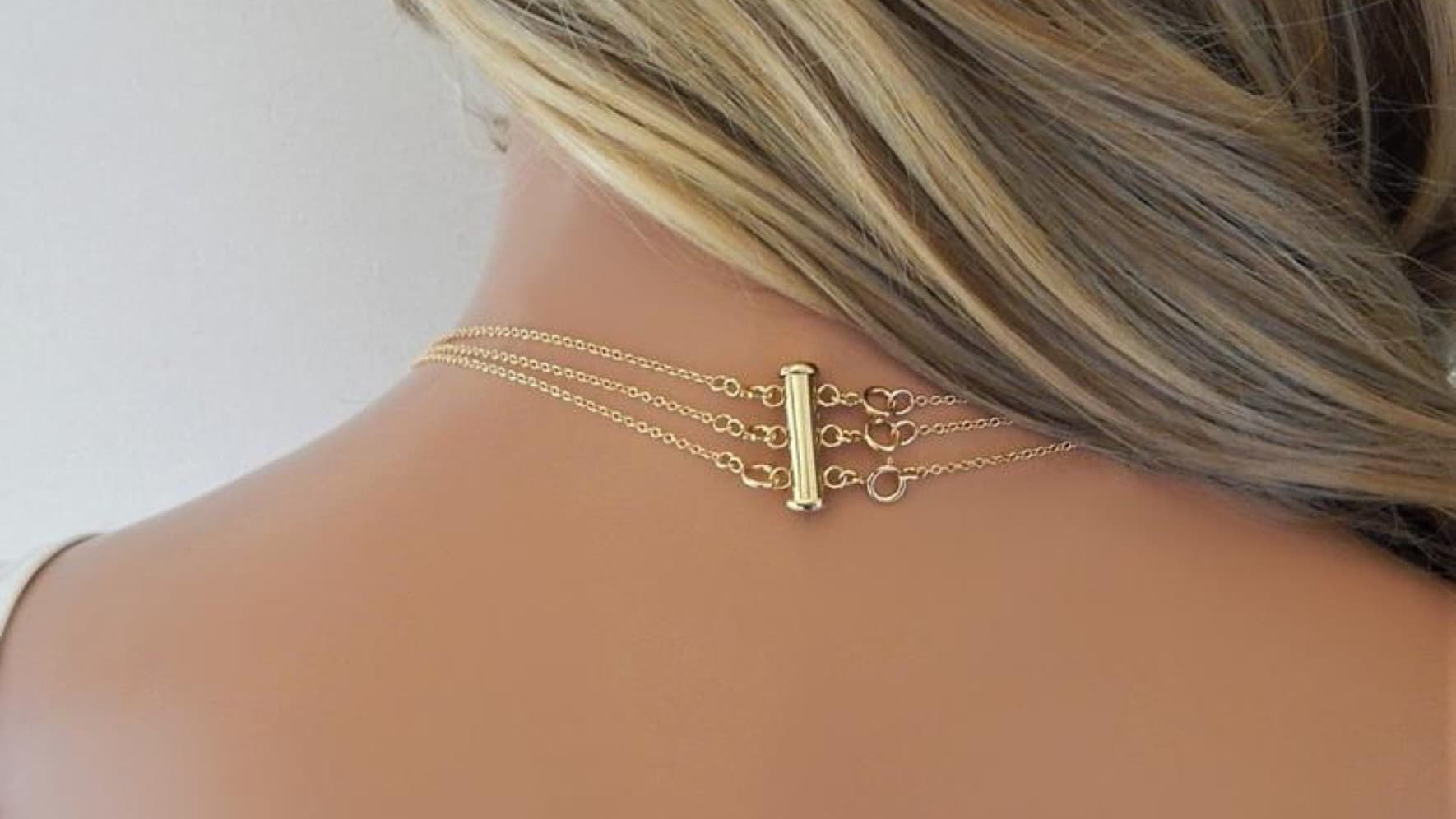 A layered necklace clasp