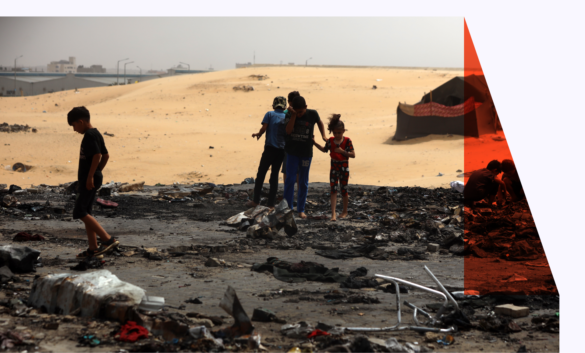 Children in what's left of burned tents in Rafah