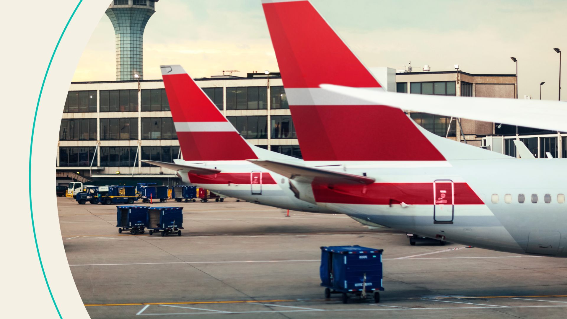 View of two airplane tails on tarmac at airport 