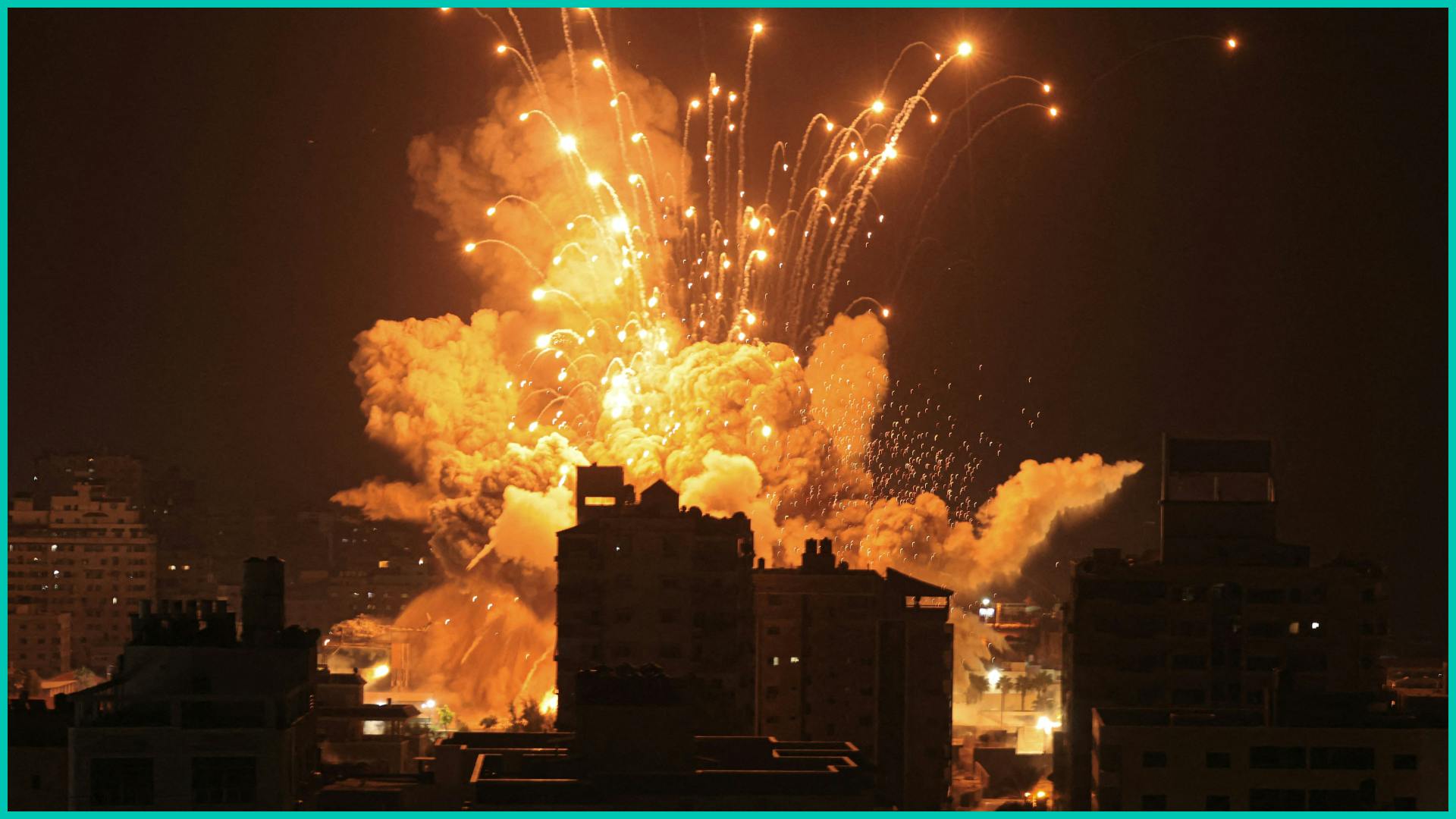 A missile explodes in Gaza City during an Israeli air strike on October 8, 2023.
