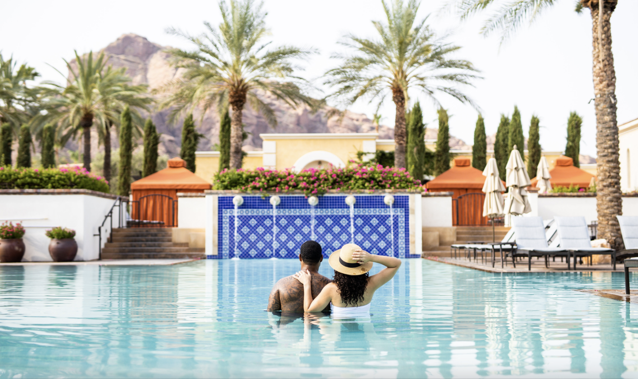 A couple swimming in a pool in Scottsdale, Arizona