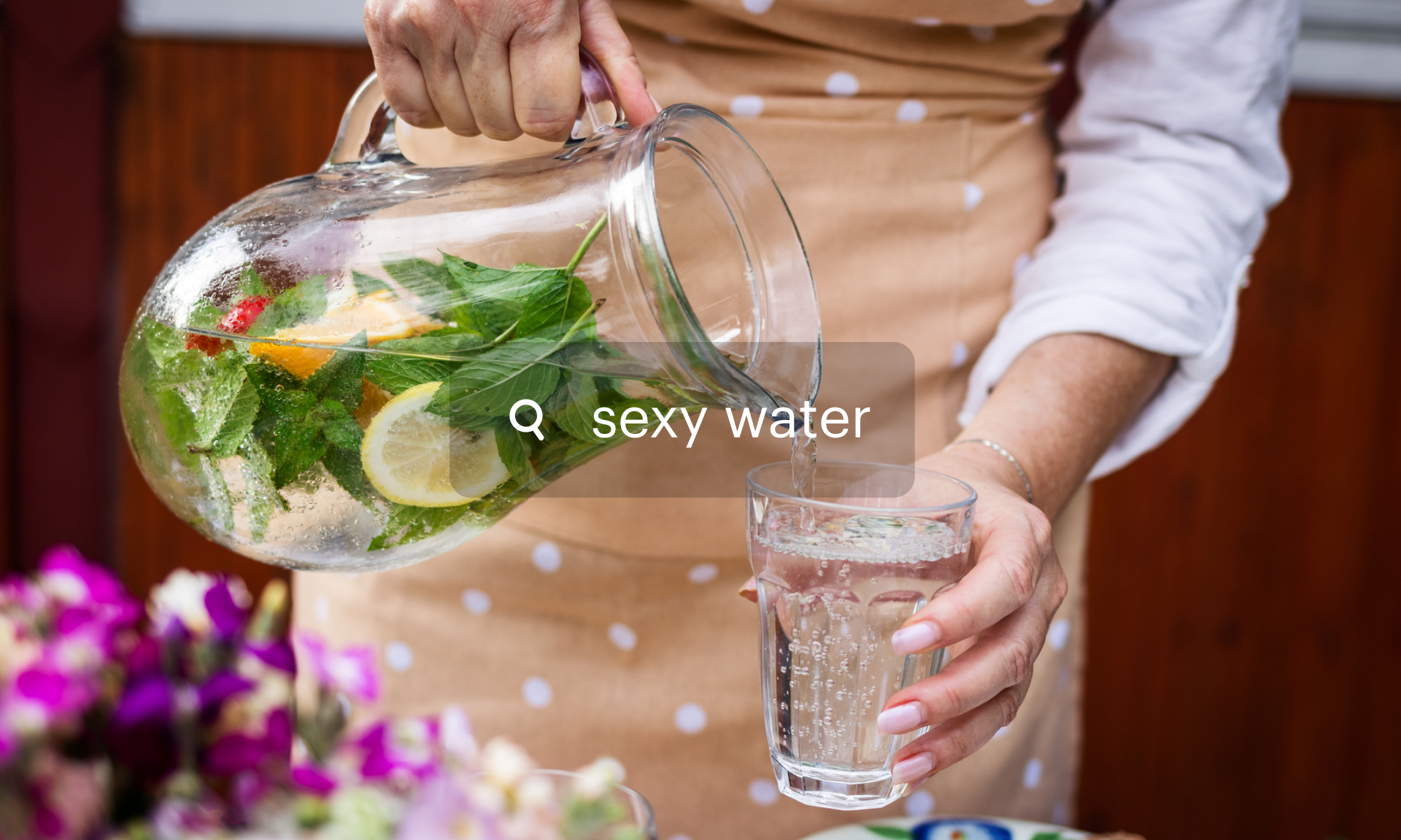 A woman pouring a pitcher of water into a glass. A search bubble reads: Sexy water