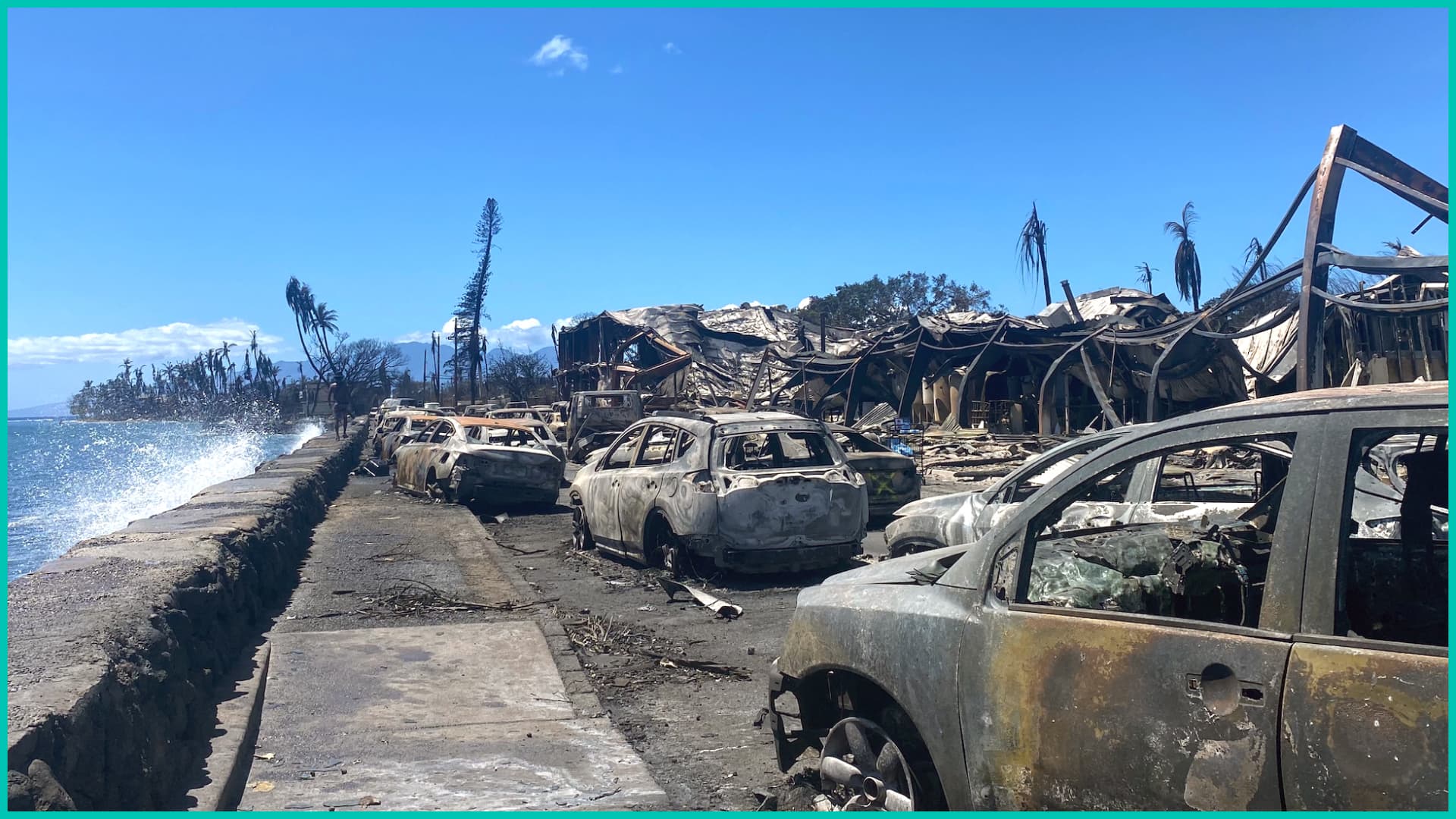 Burned cars and destroyed buildings are pictured in the aftermath of a wildfire in Lahaina, western Maui, Hawaii on August 11, 2023.