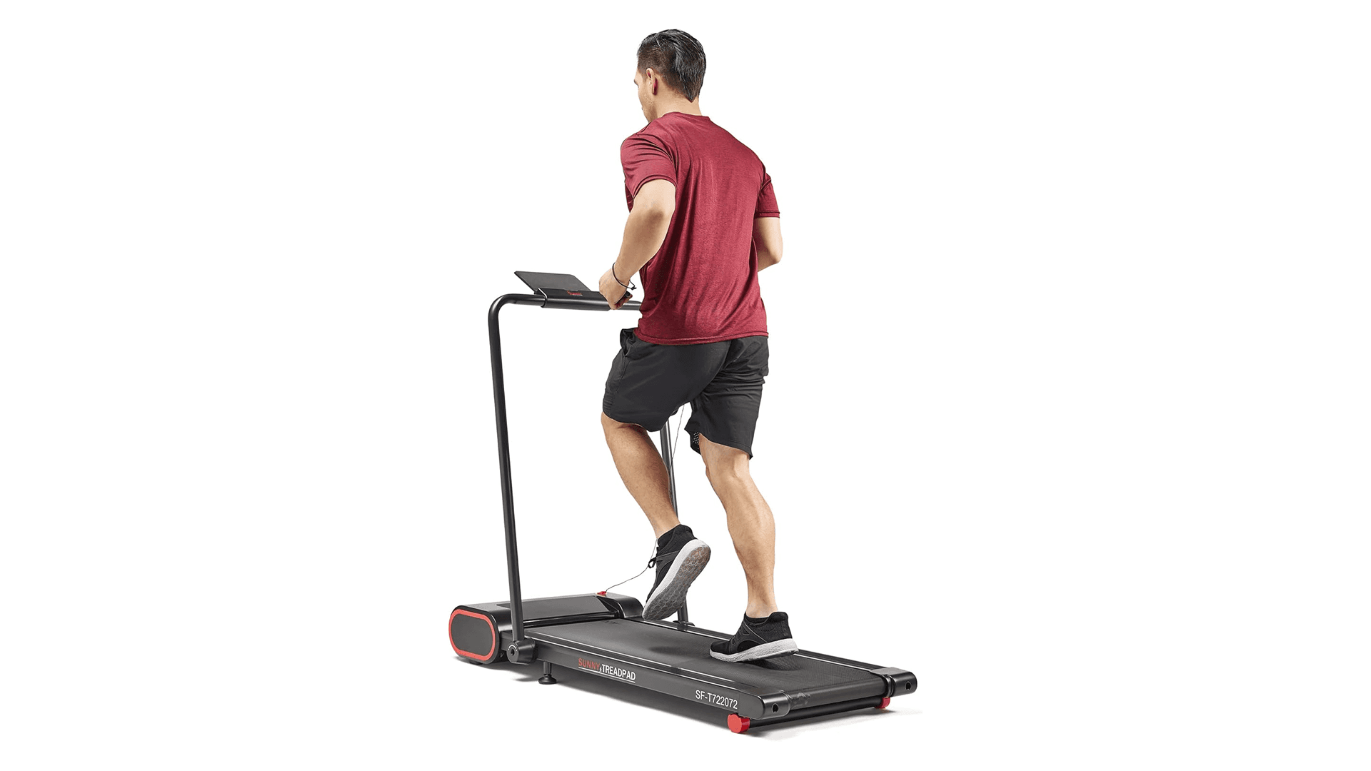 Man running on under-desk treadmill