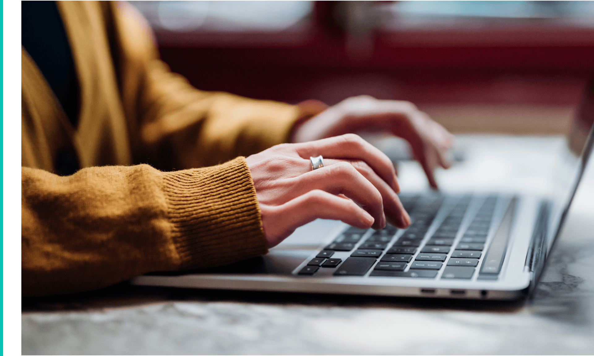 ide view of female hand typing on laptop keyboard. Freelancer working with laptop at cafe. Technology and flexible working.