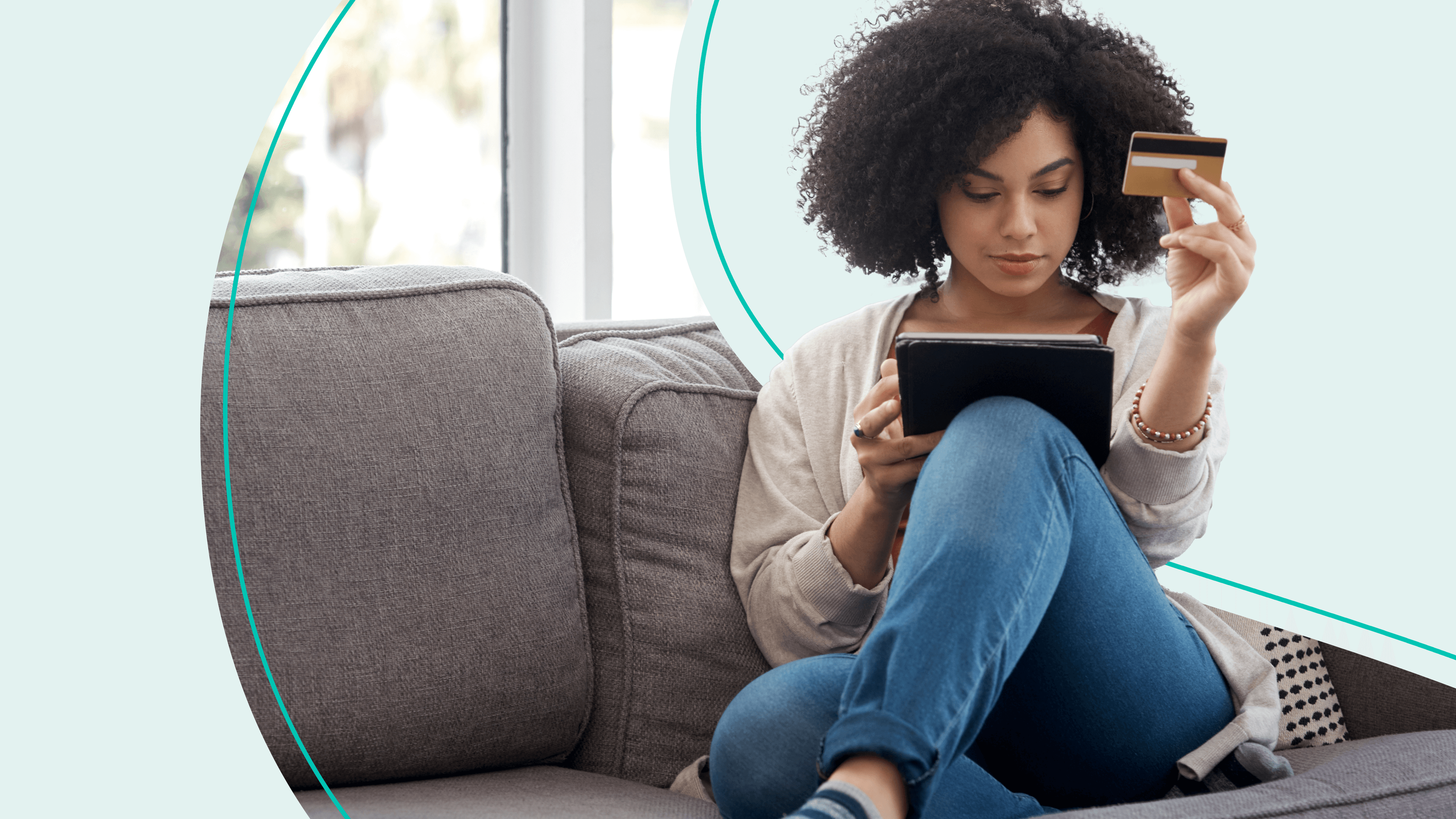 woman with credit card and tablet