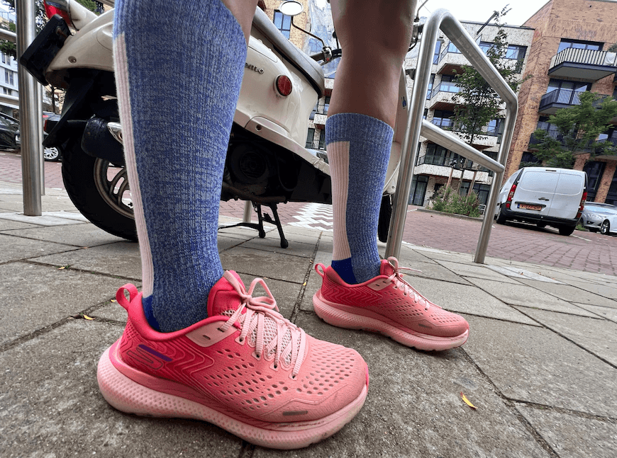 Closeup of legs in Bombas Performance Compression Socks and sneakers