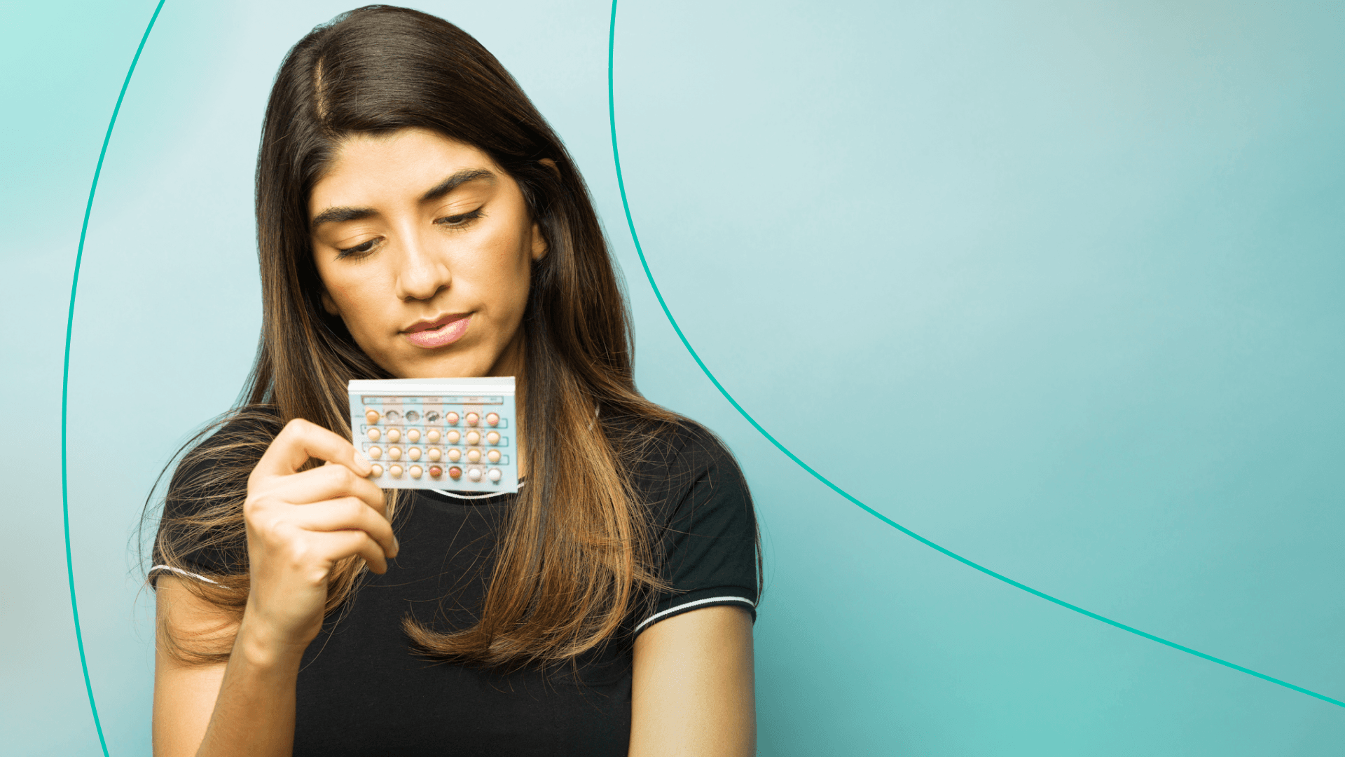 Woman examining bc pills