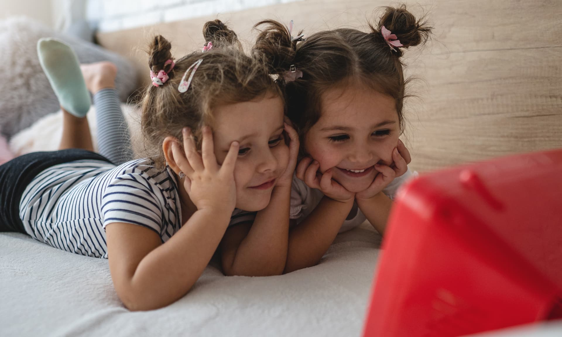 two girls watching tablet