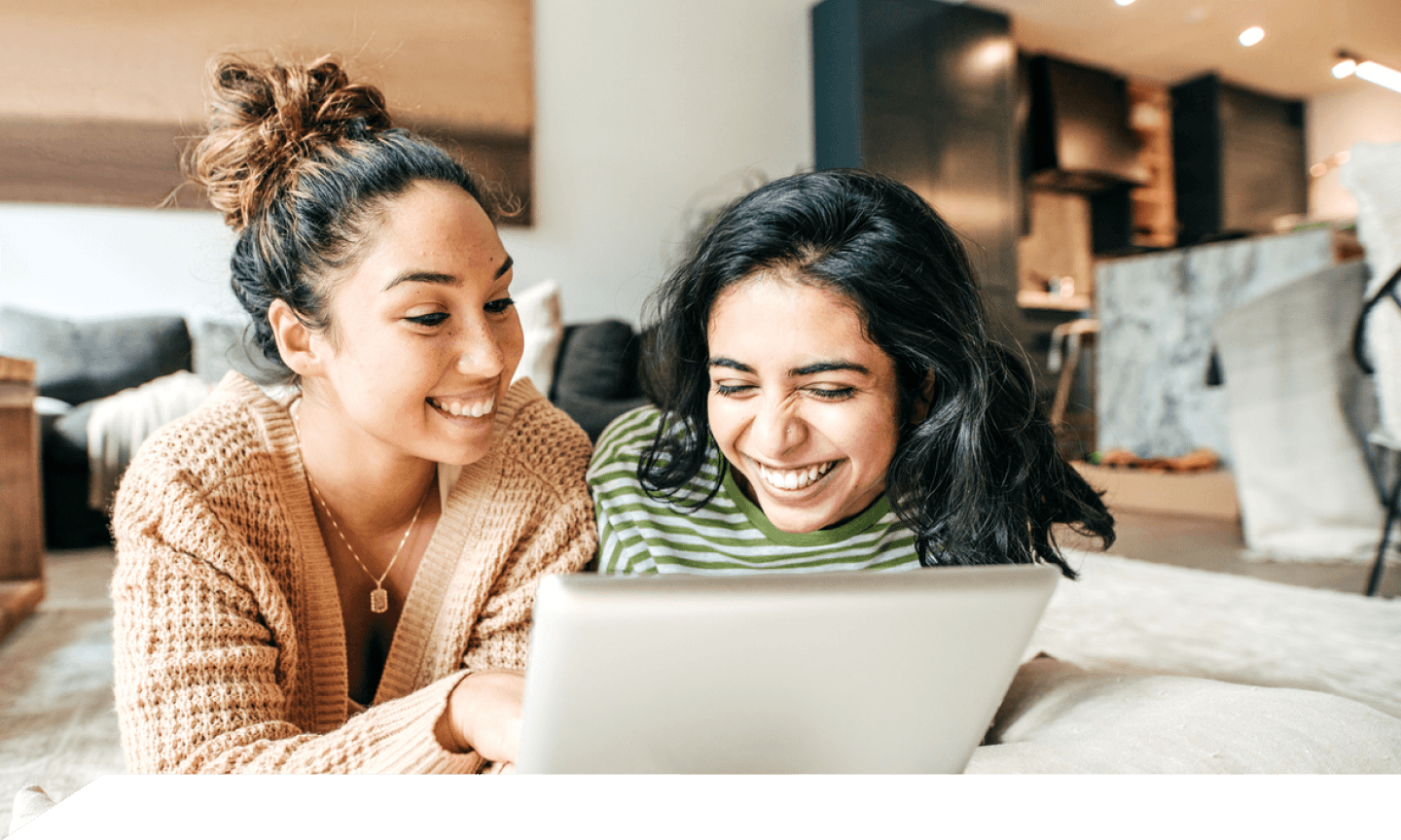 Two girls with digital tablet and cellphone at home