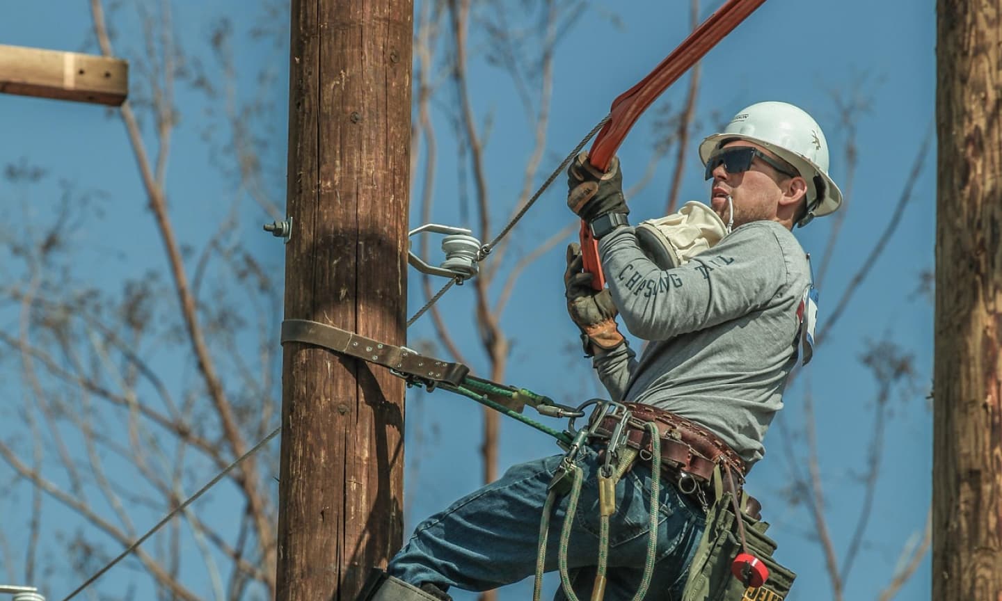 man fixing an electrical line