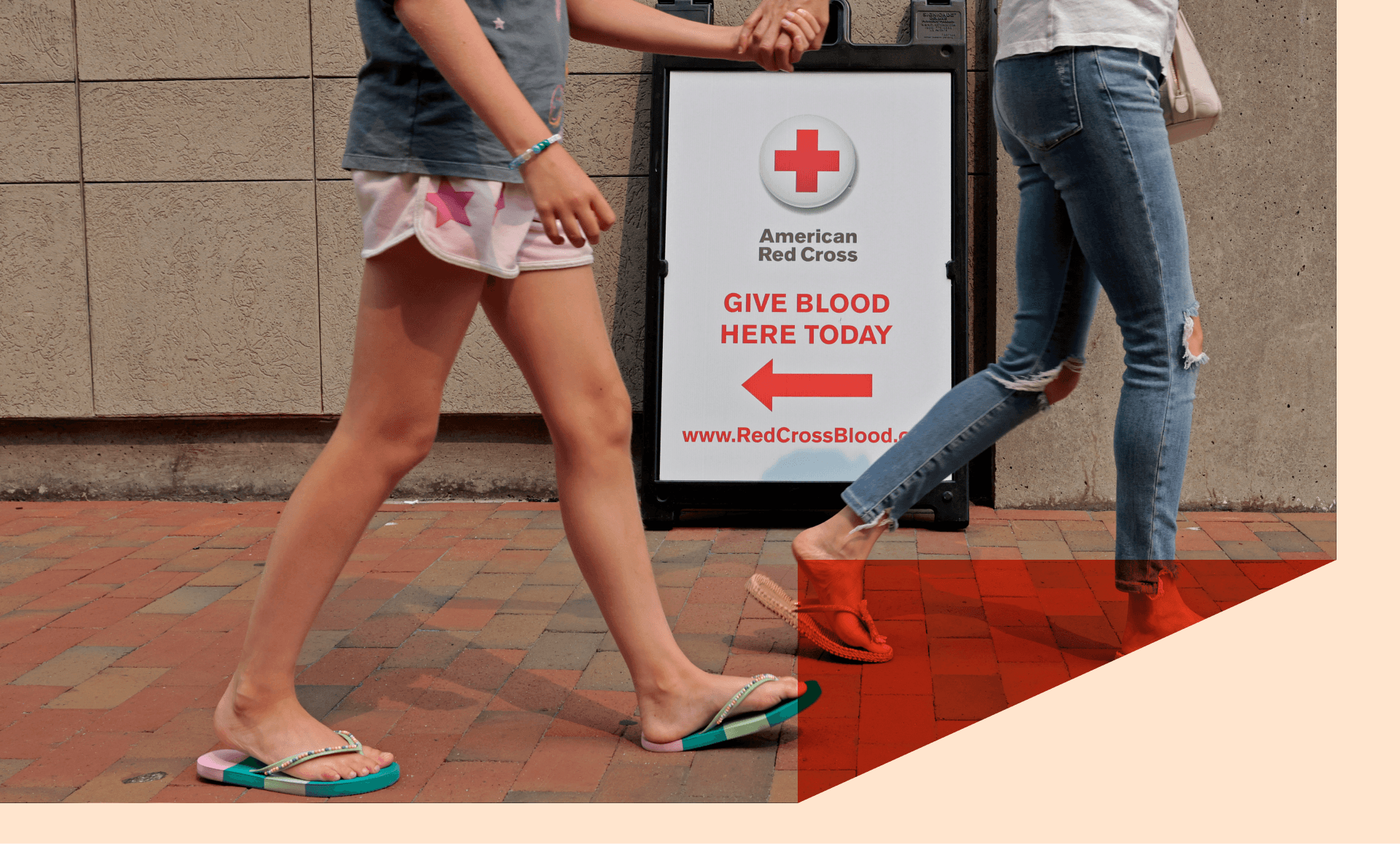 Pedestrians walk past the American Red Cross Blood Donation Center on July 14, 2026