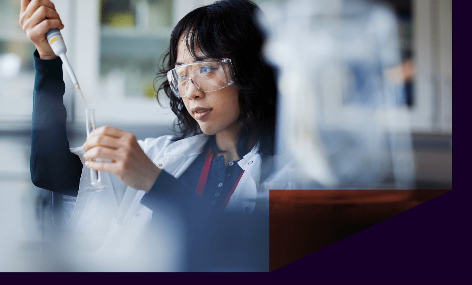 A scientist holds a test tube in lab