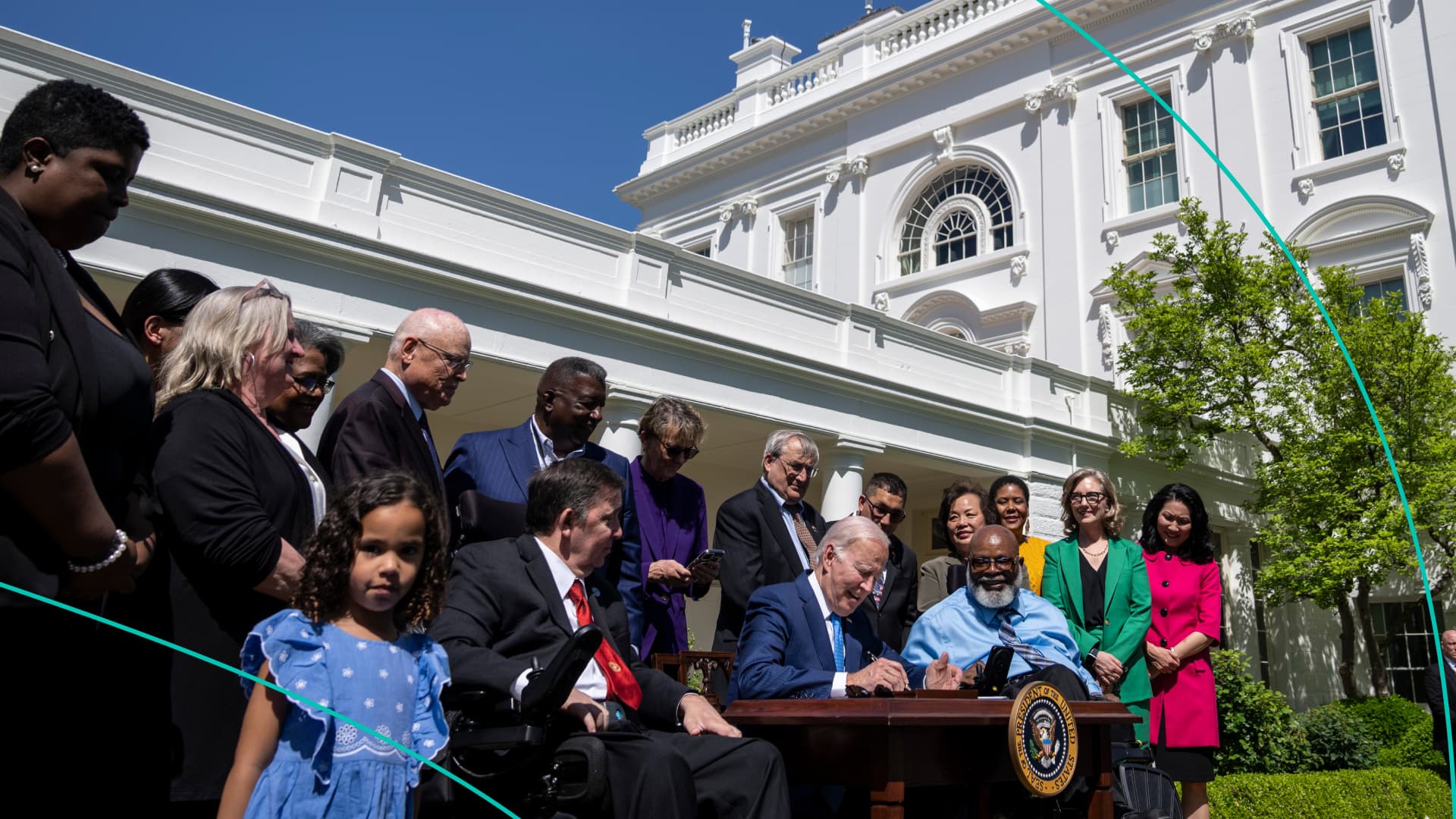 U.S. President Joe Biden signs an executive order related to childcare and eldercare during an event in the Rose Garden of the White House April 18, 2023 in Washington, DC