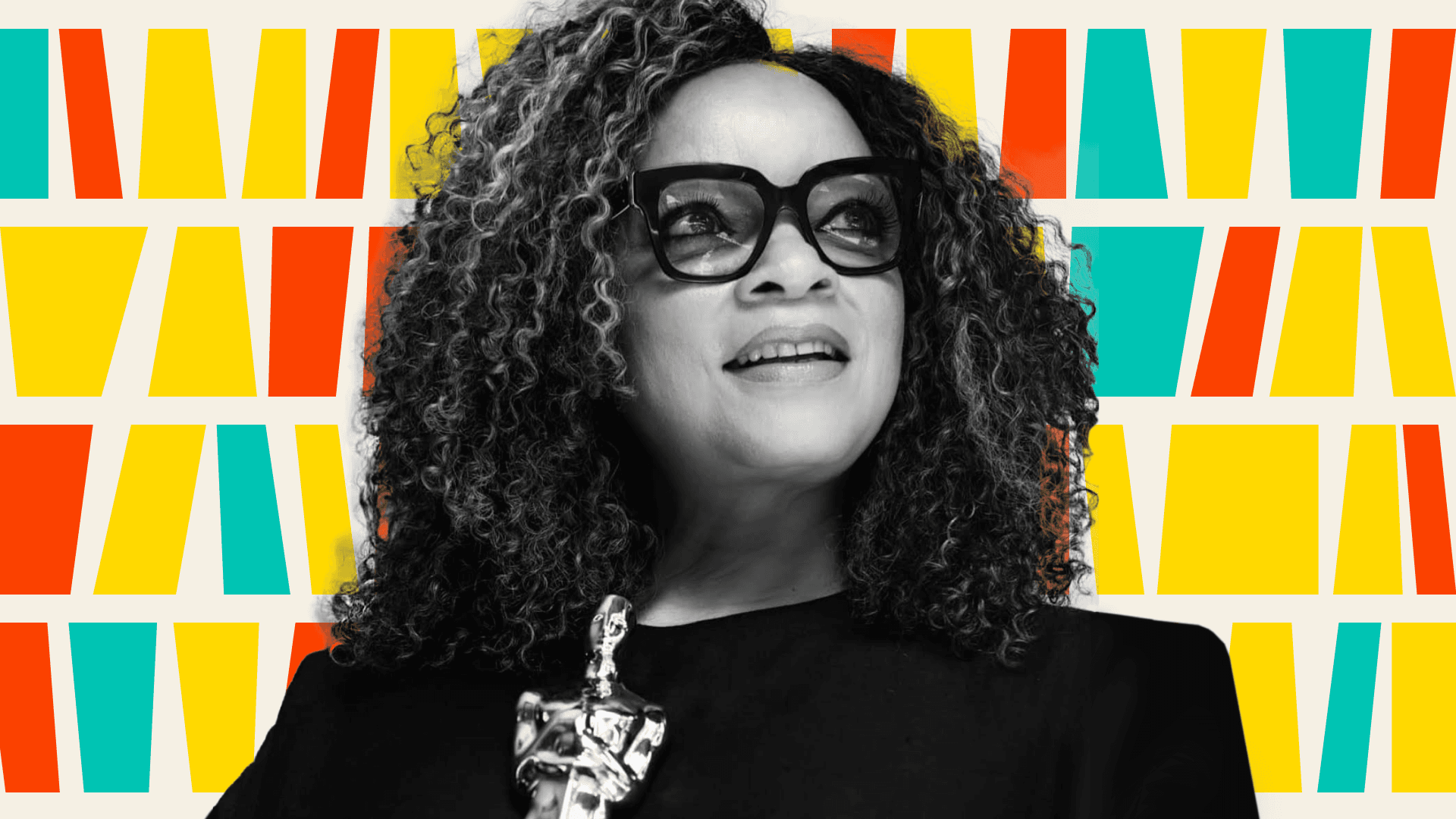 Ruth Carter holding Oscar.