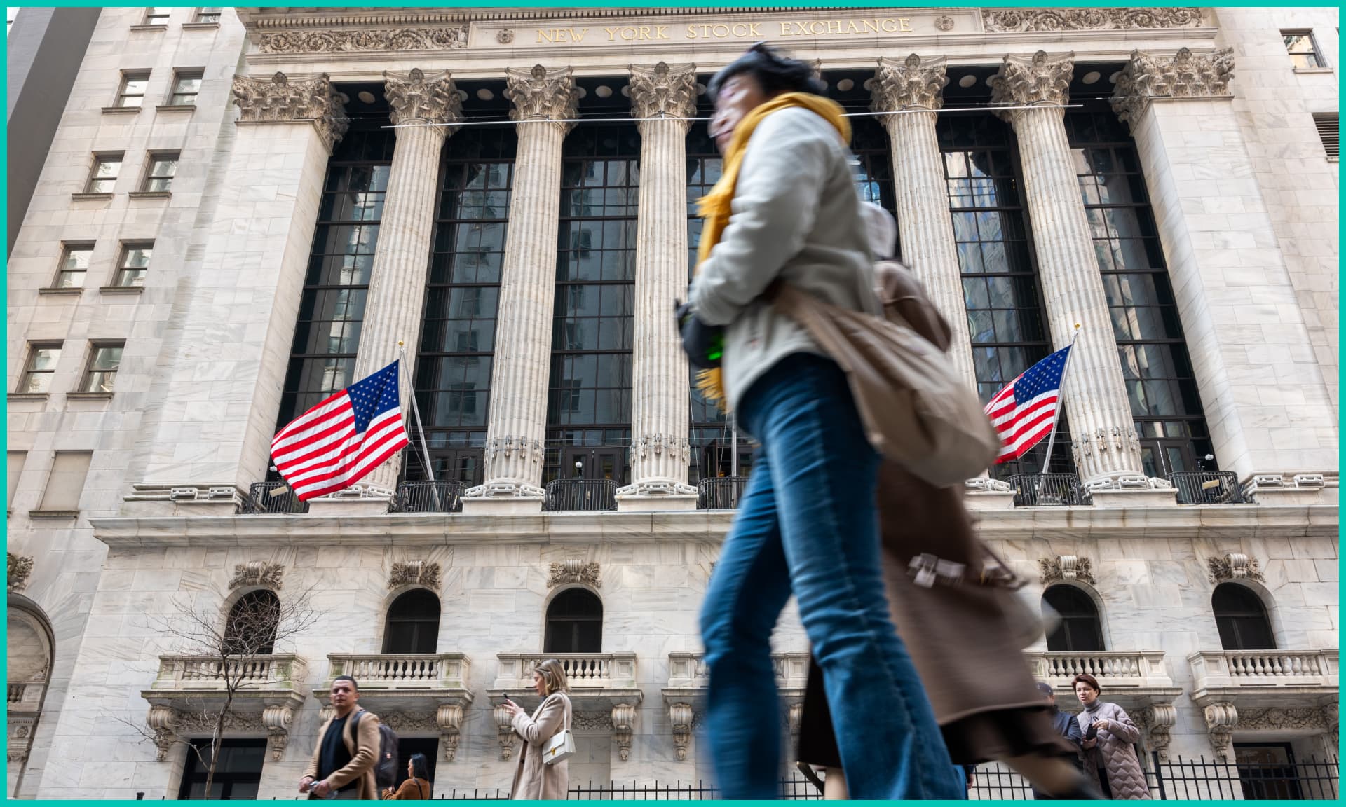 People walk past the New York Stock Exchange (NYSE) on April 10, 2024 in New York City.