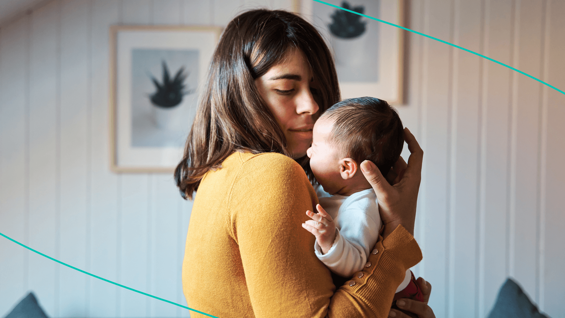 photo of woman holding newborn