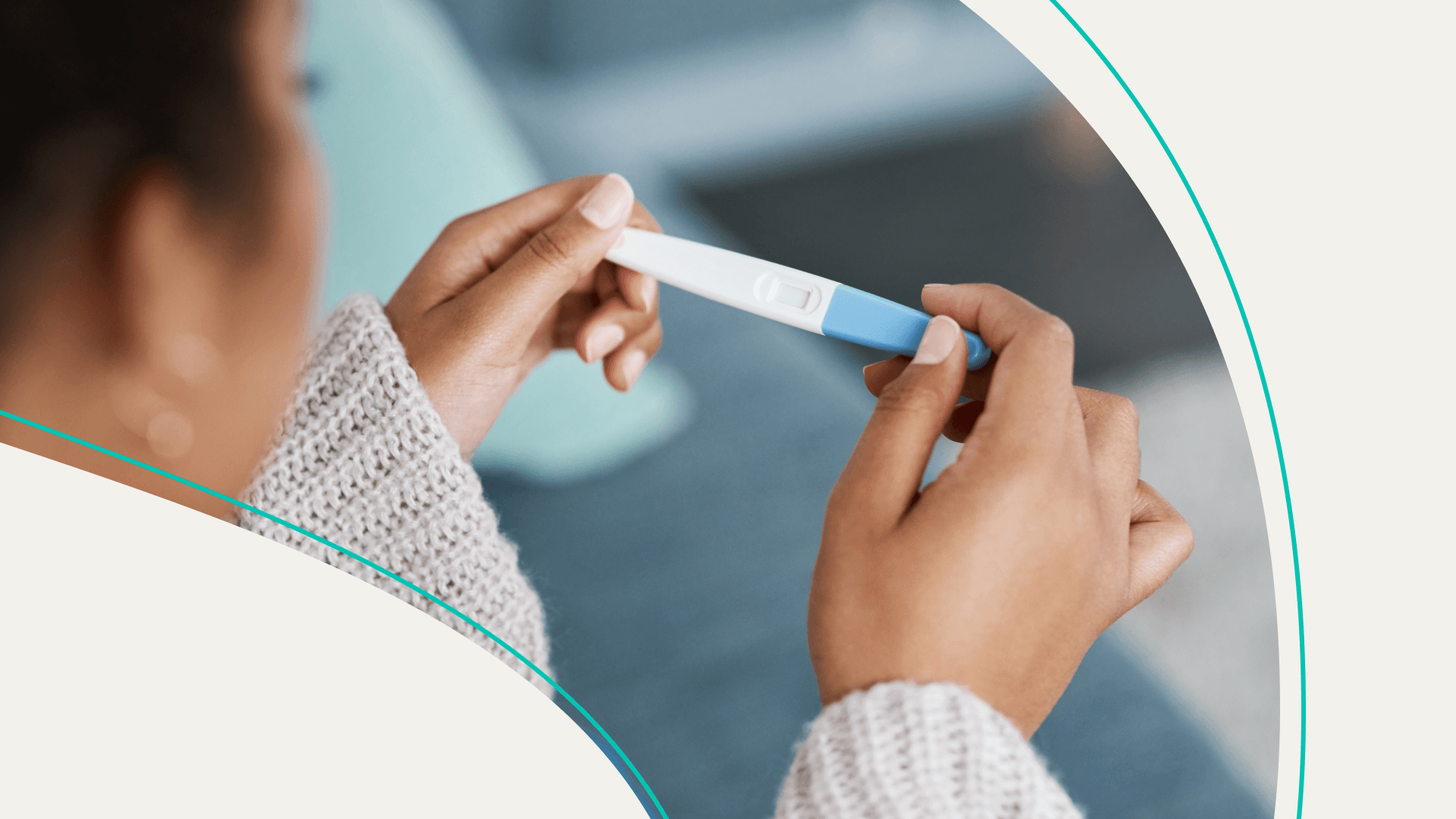 A woman holding a pregnancy test