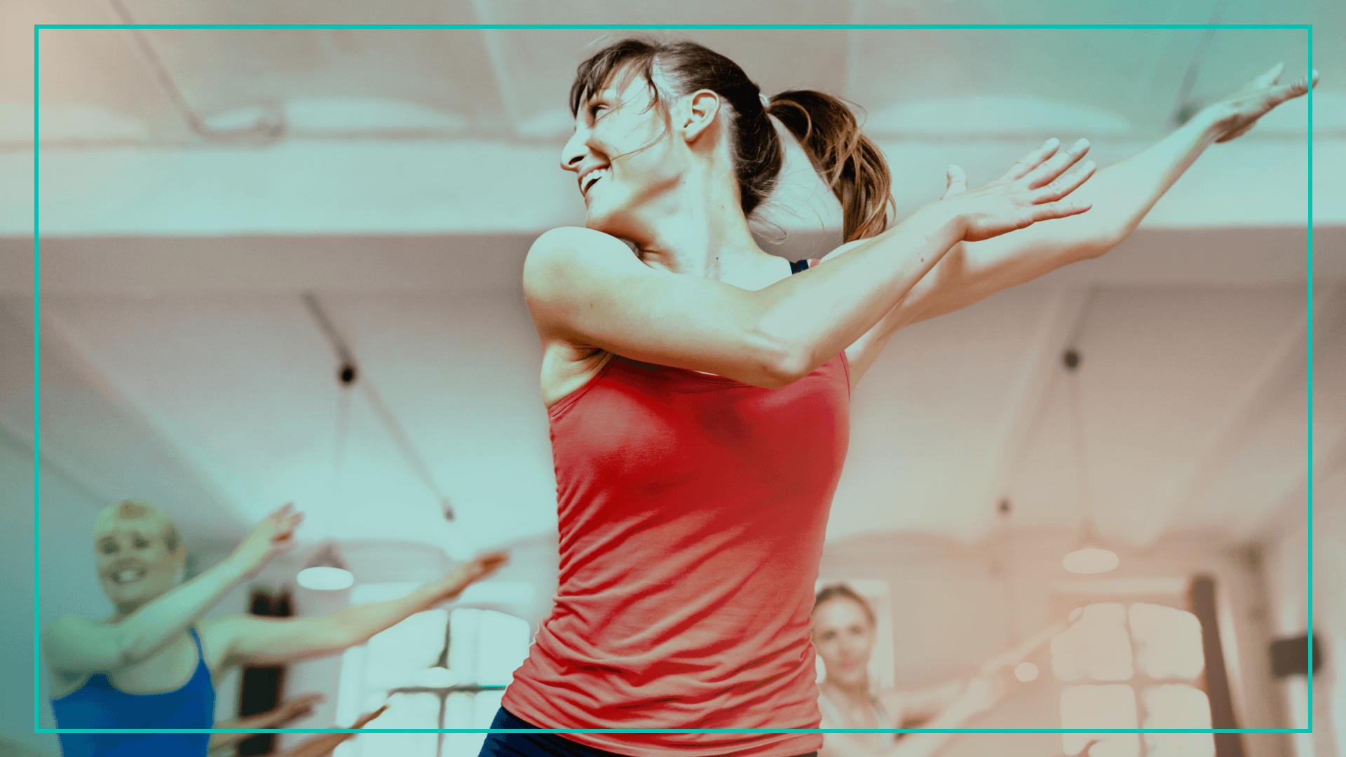 Woman in exercise class dancing and smiling