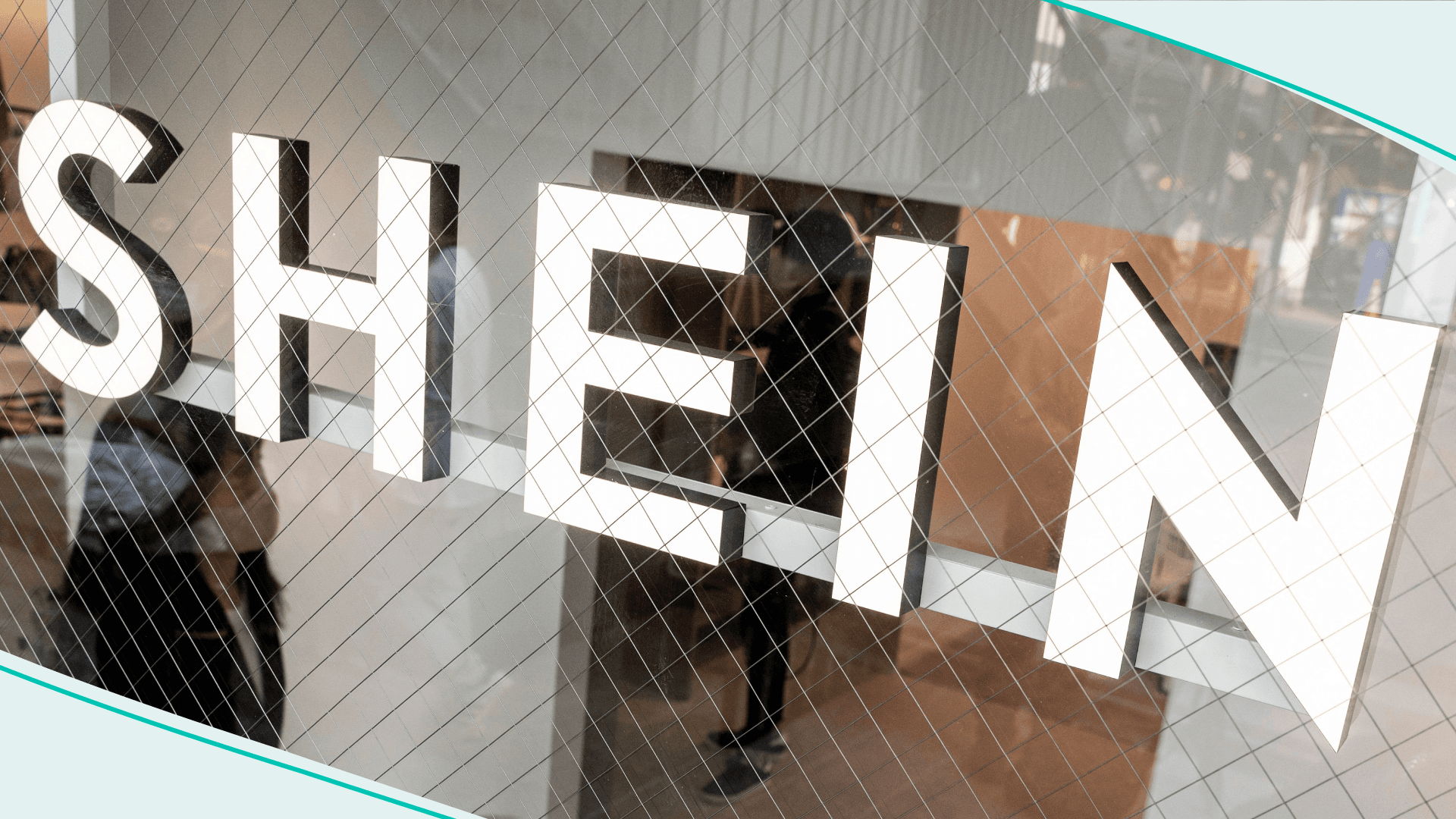 This photo taken on November 10, 2022 shows a woman walking inside the first permanent showroom of Chinese online fast fashion giant Shein, during a media preview in Tokyo.