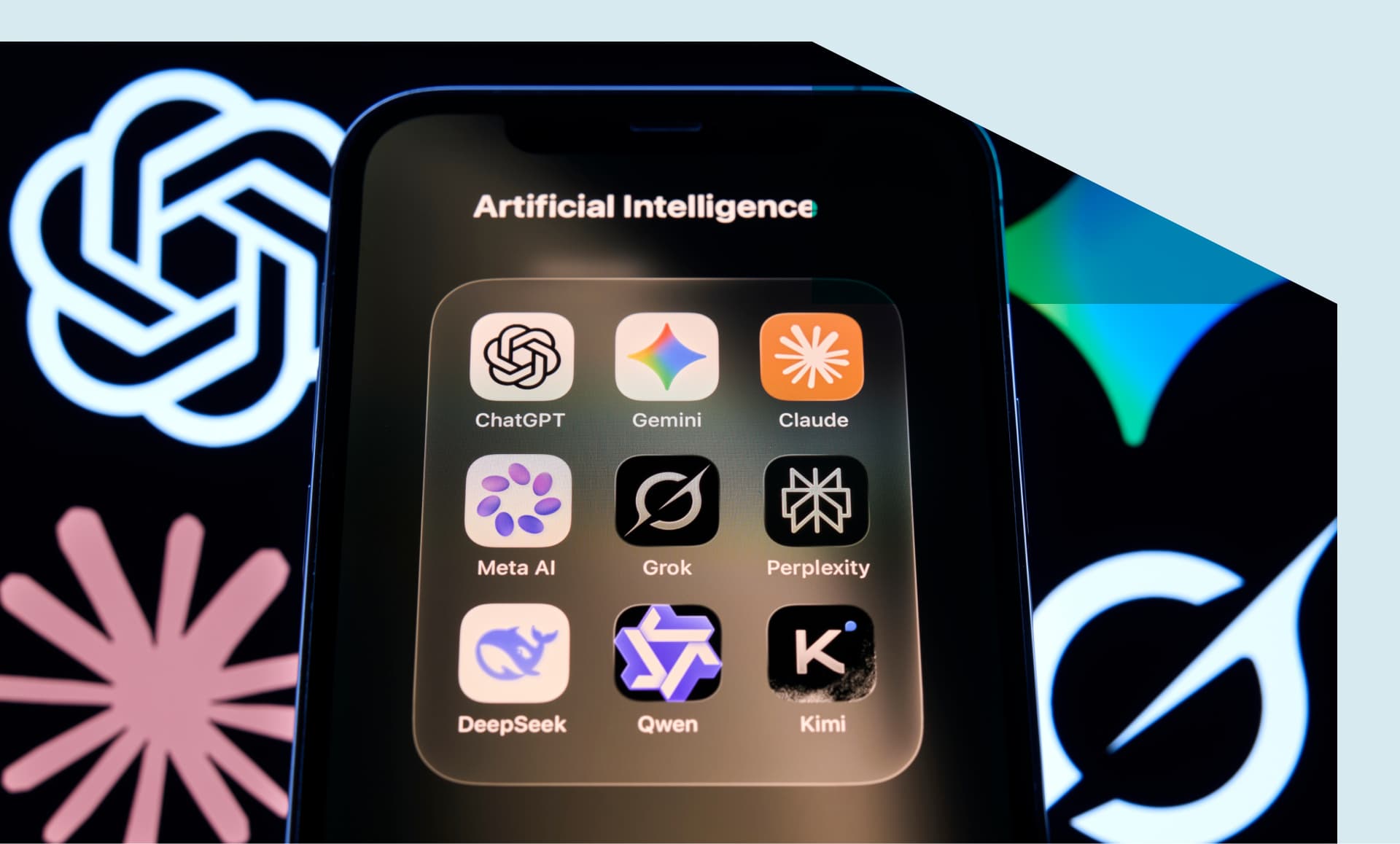ChatGPT, Gemini, Claude, Meta AI, Grok, Perplexity, DeepSeek, Qwen and Kimi app icons are grouped in an Artificial Intelligence folder on an iPhone home screen.