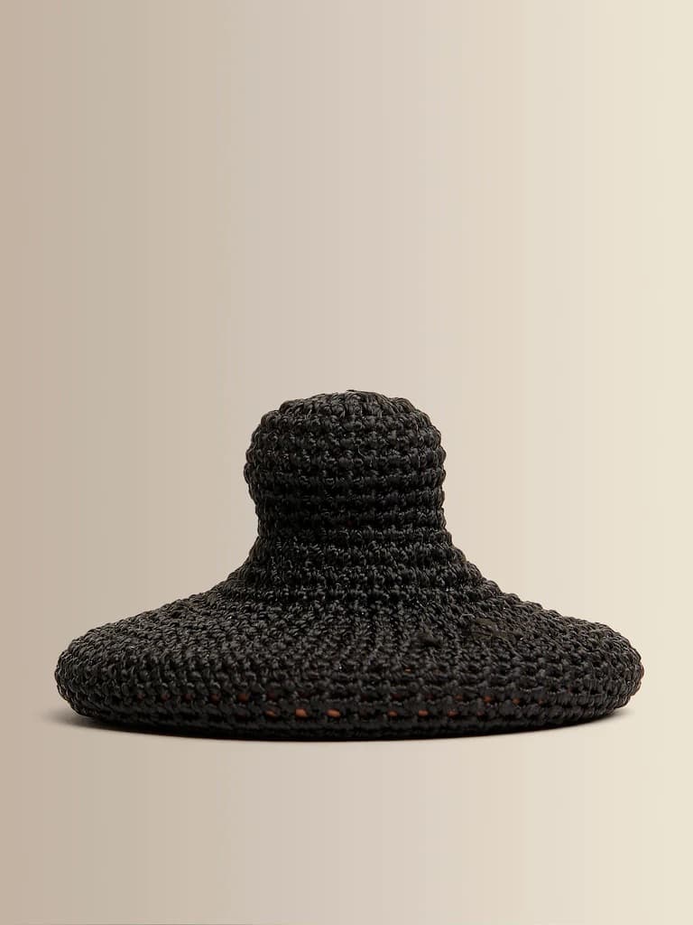 A terracotta and cotton body exfoliation tool.