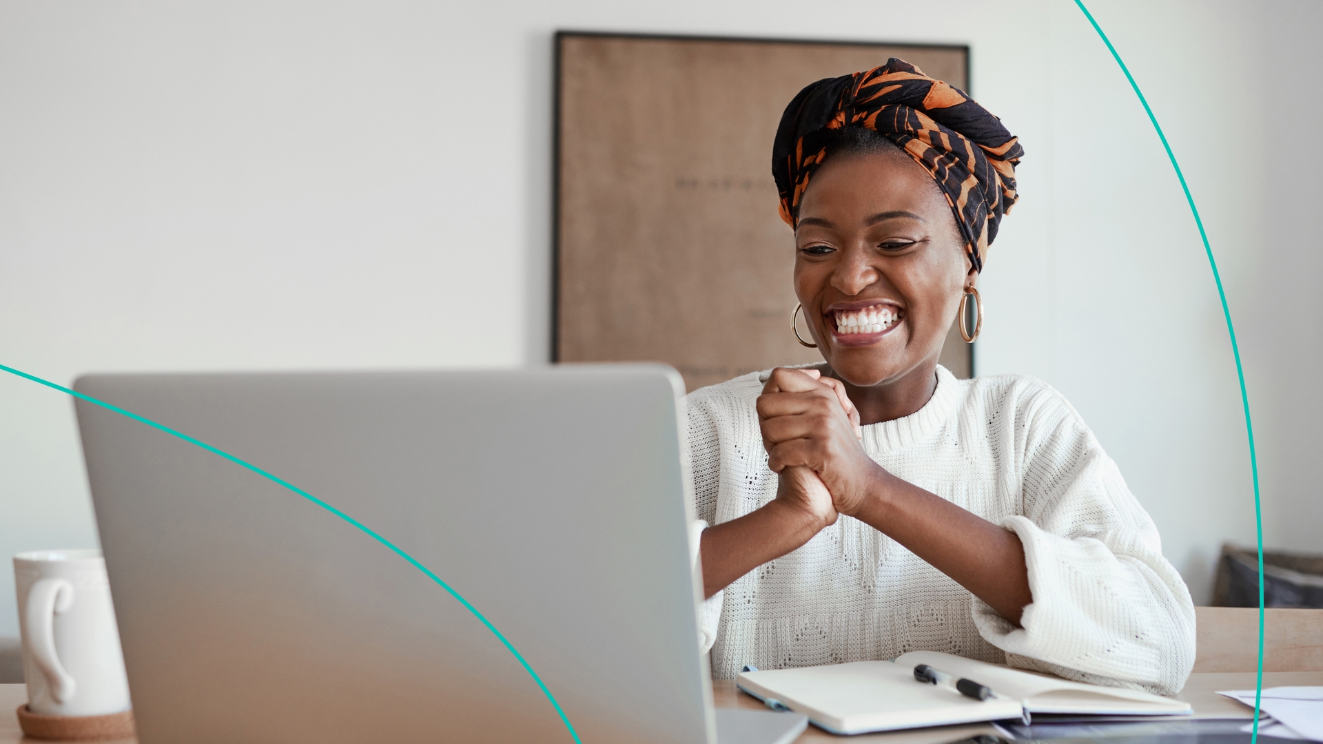 Woman happy at computer.