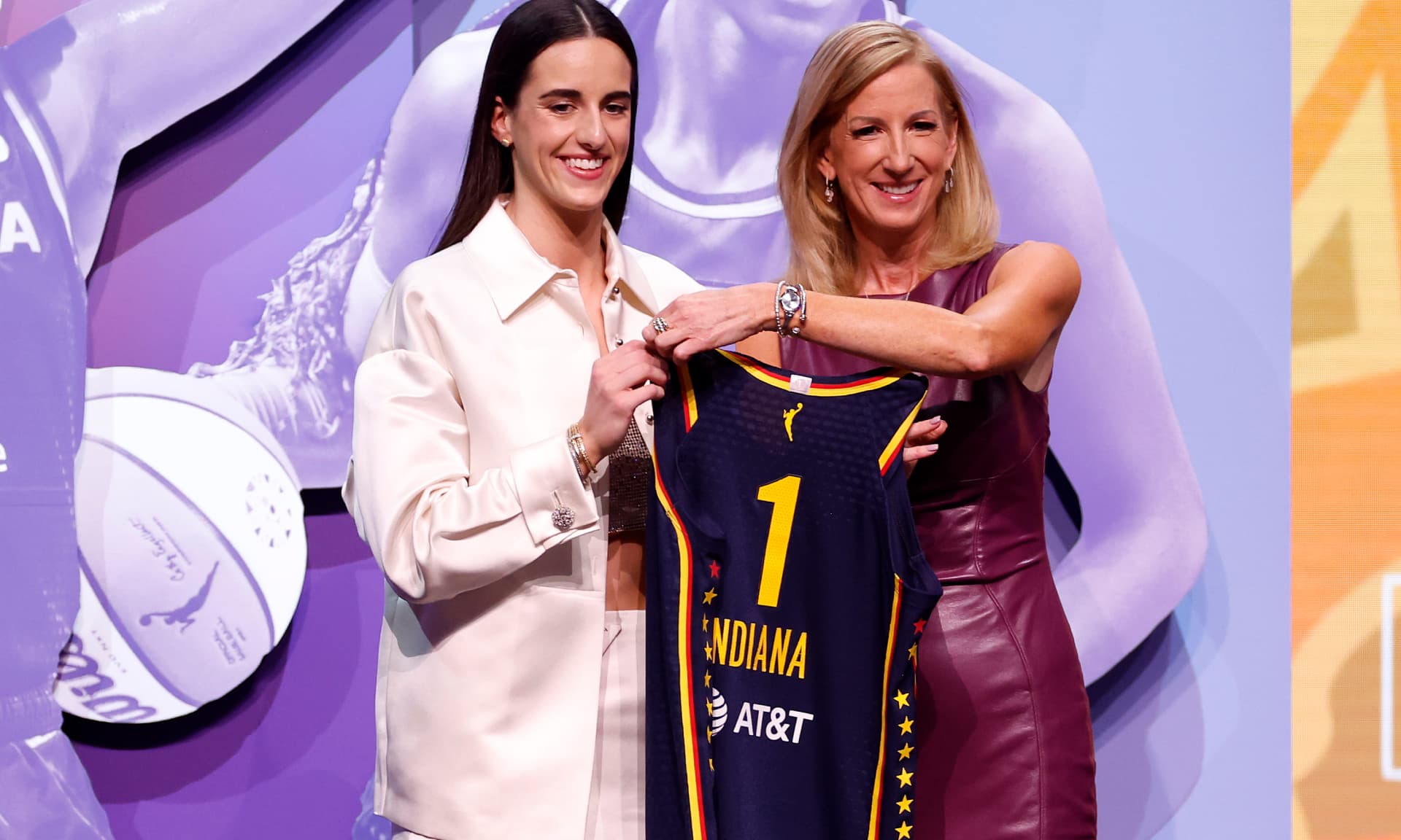 Caitlin Clark poses with WNBA Commissioner Cathy Engelbert after being selected first overall pick by the Indiana Fever