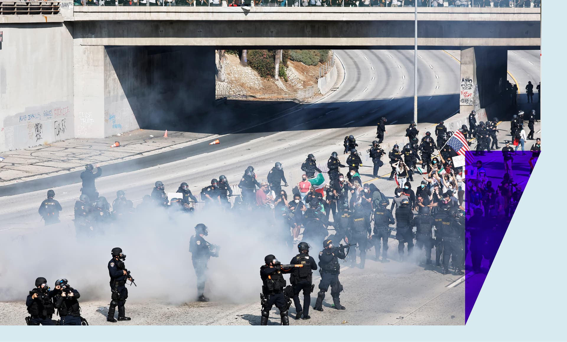 Protesters and law enforcement standing off on the 101 freeway in LA