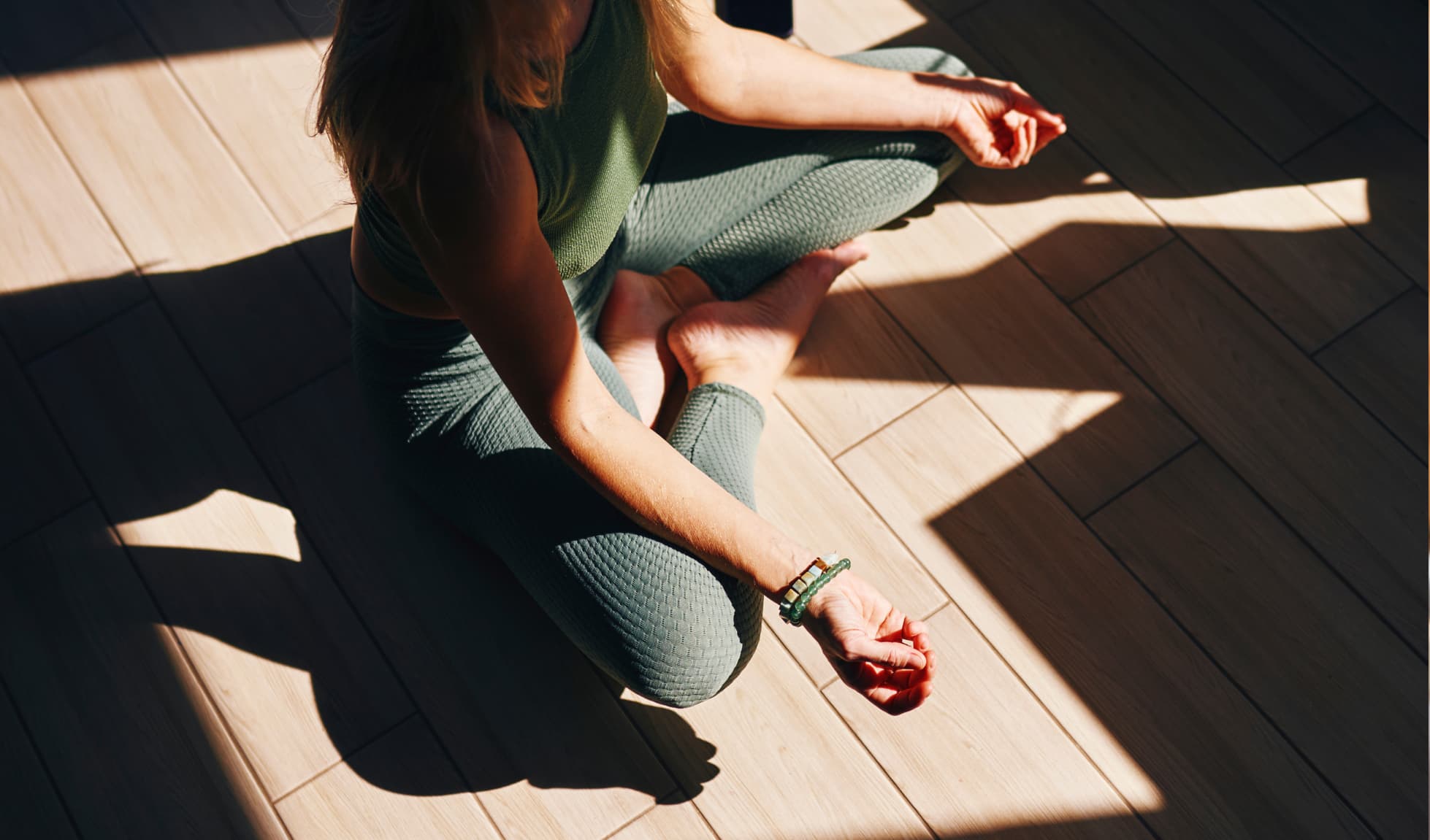 Woman meditating with legs crossed