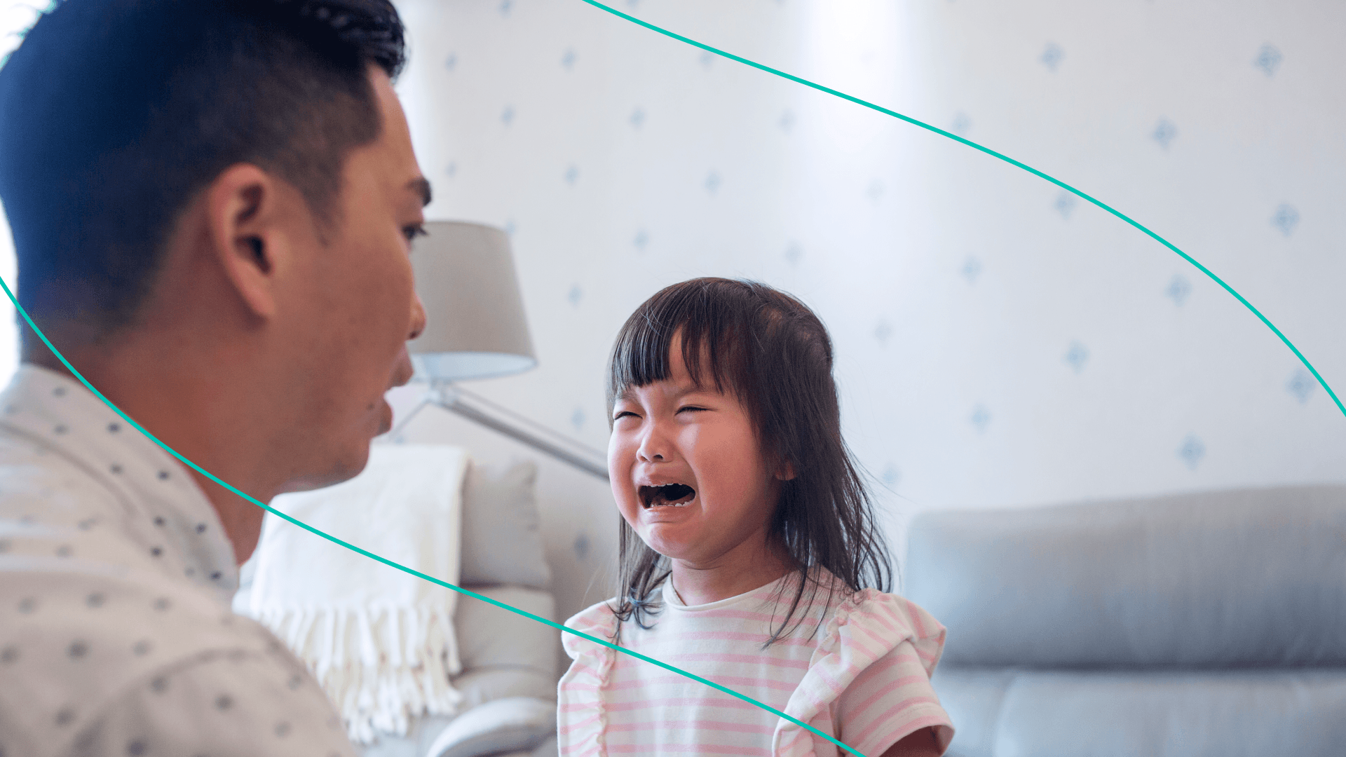 Little girl cries in font of father