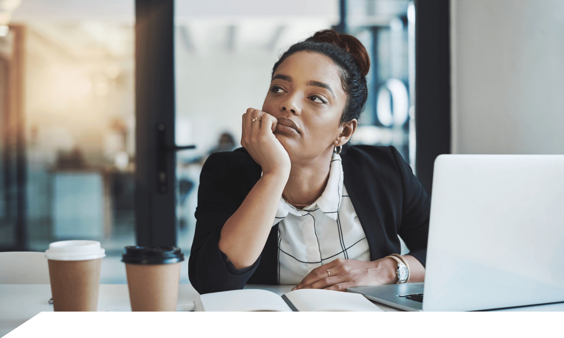 A woman at work looking off into the distance