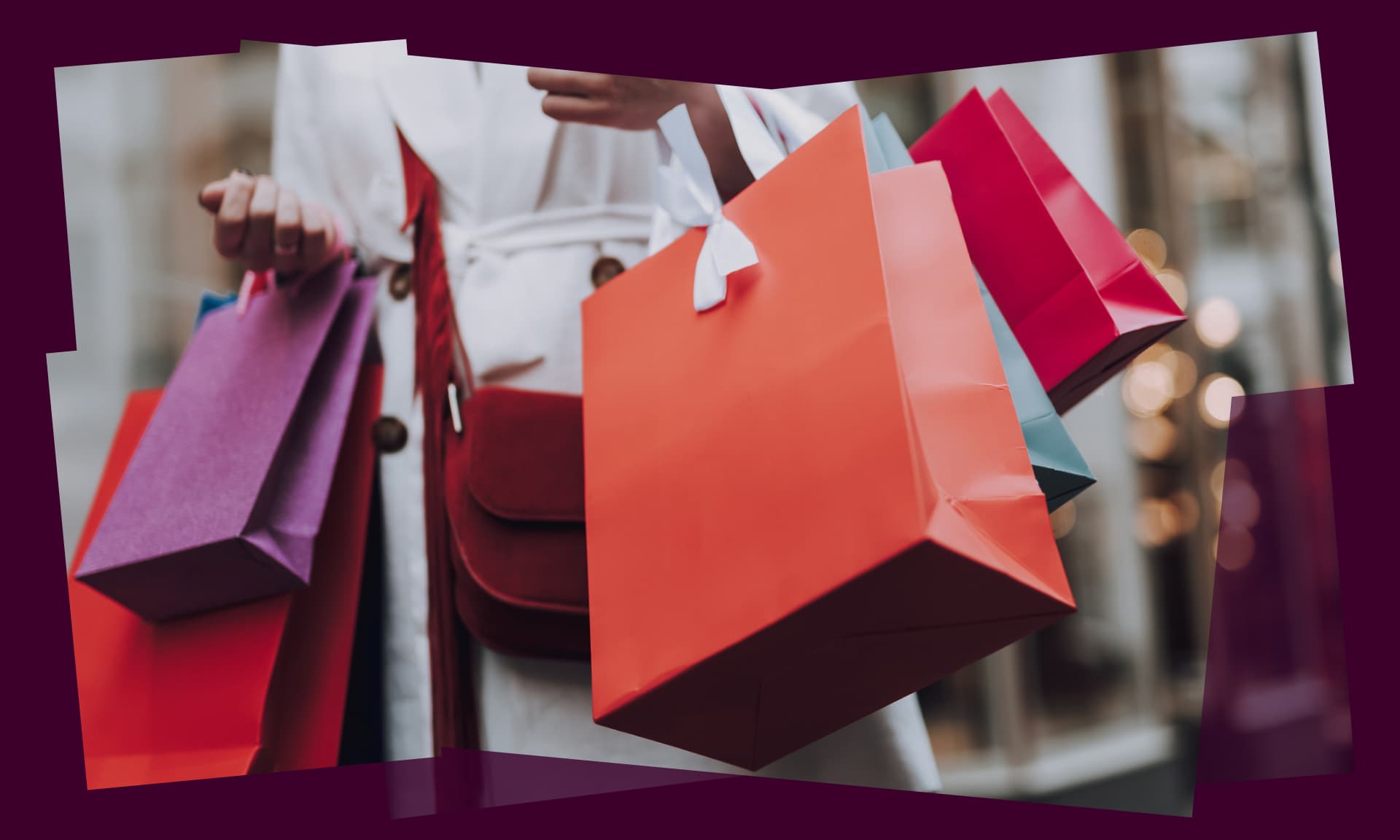 woman holding many shopping bags