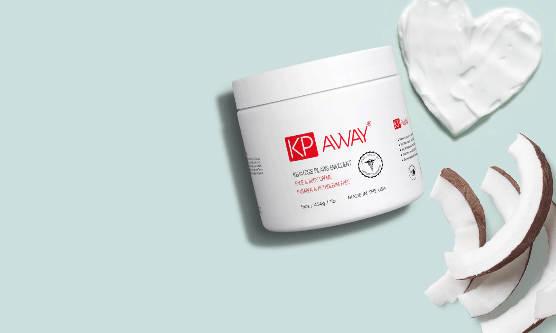 Jar of moisturizer on pale blue background with slices of coconut and a heart made of moisturizer