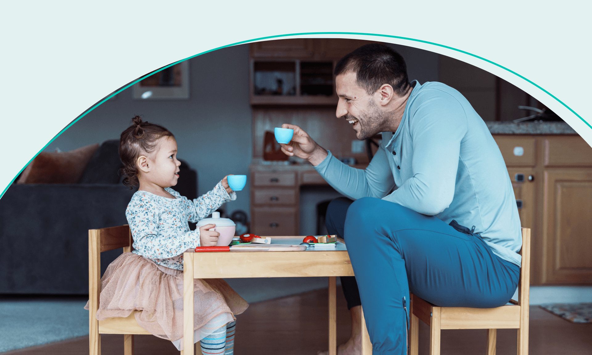 dad and daughter having tea time