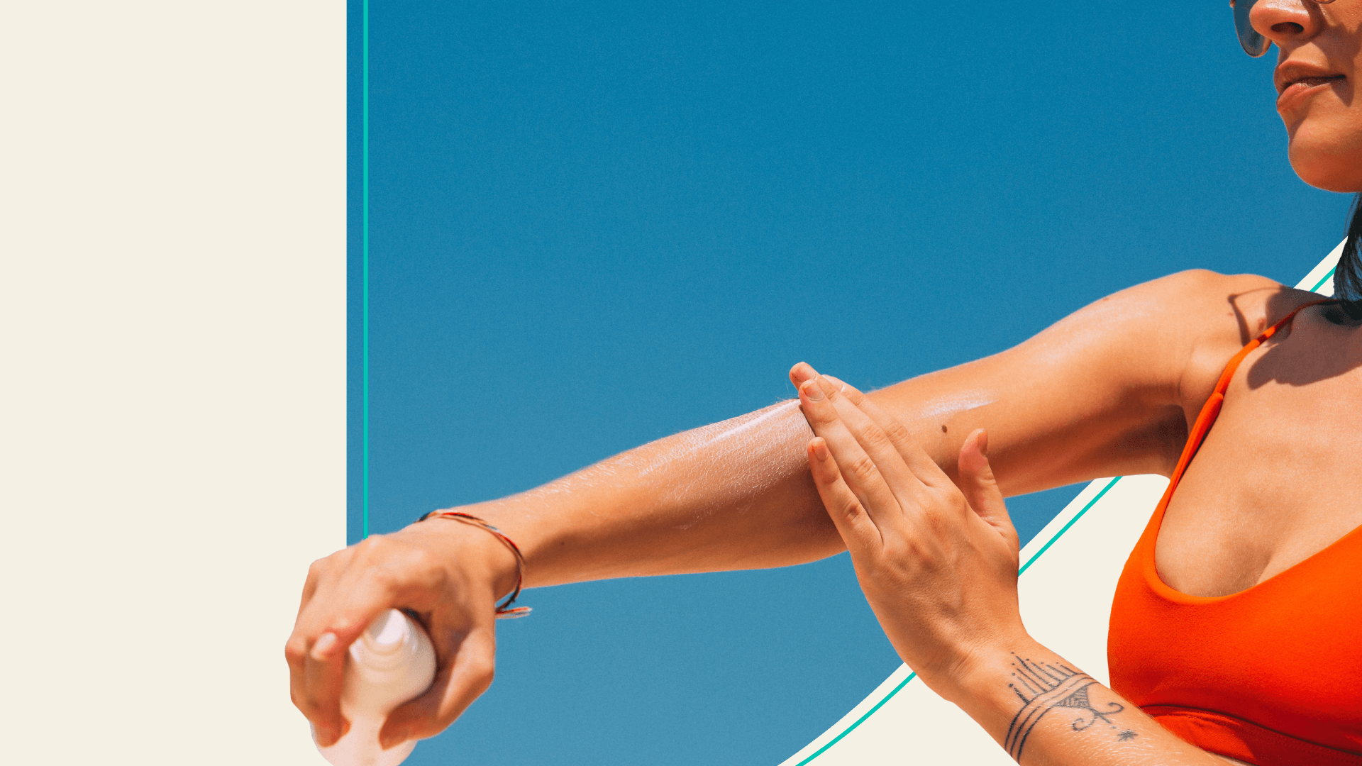 A woman lathering sunscreen on her arm