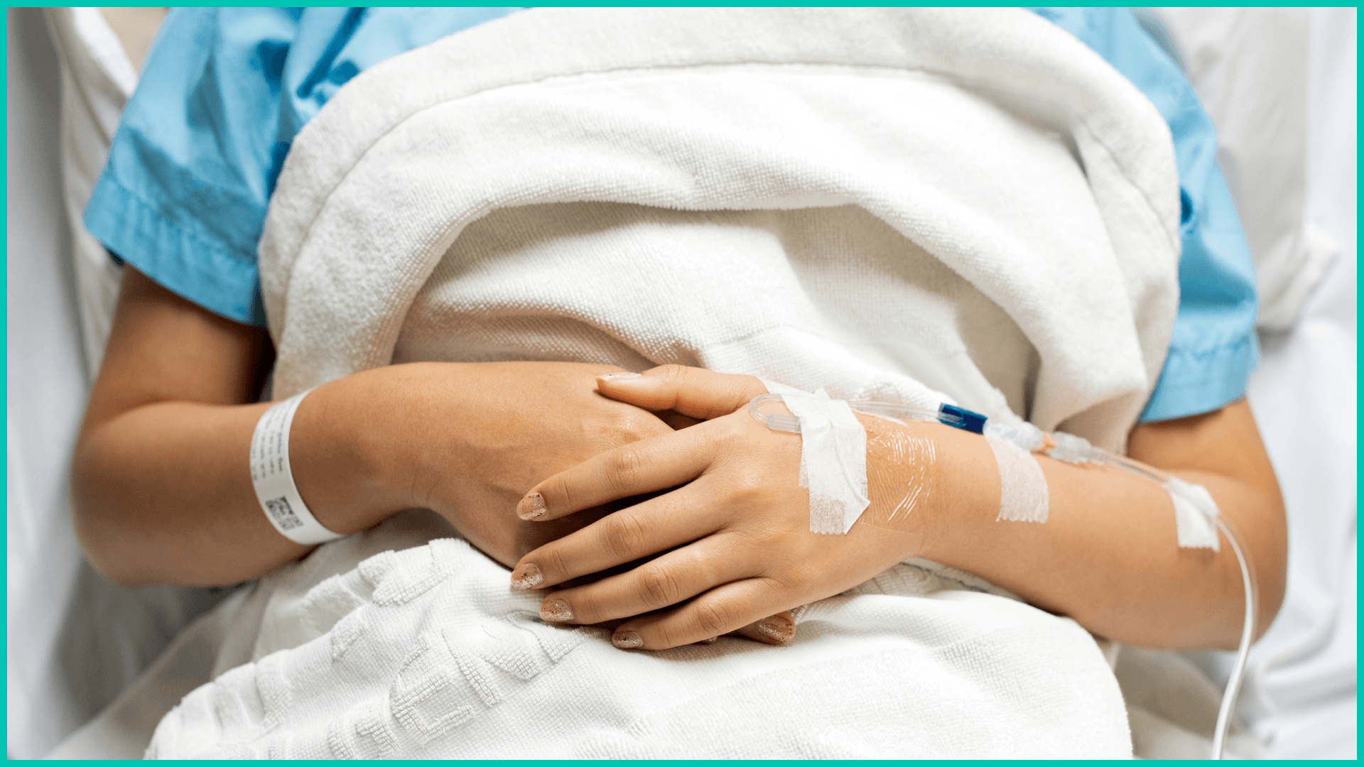 Woman receiving IV in hospital during COVID-19