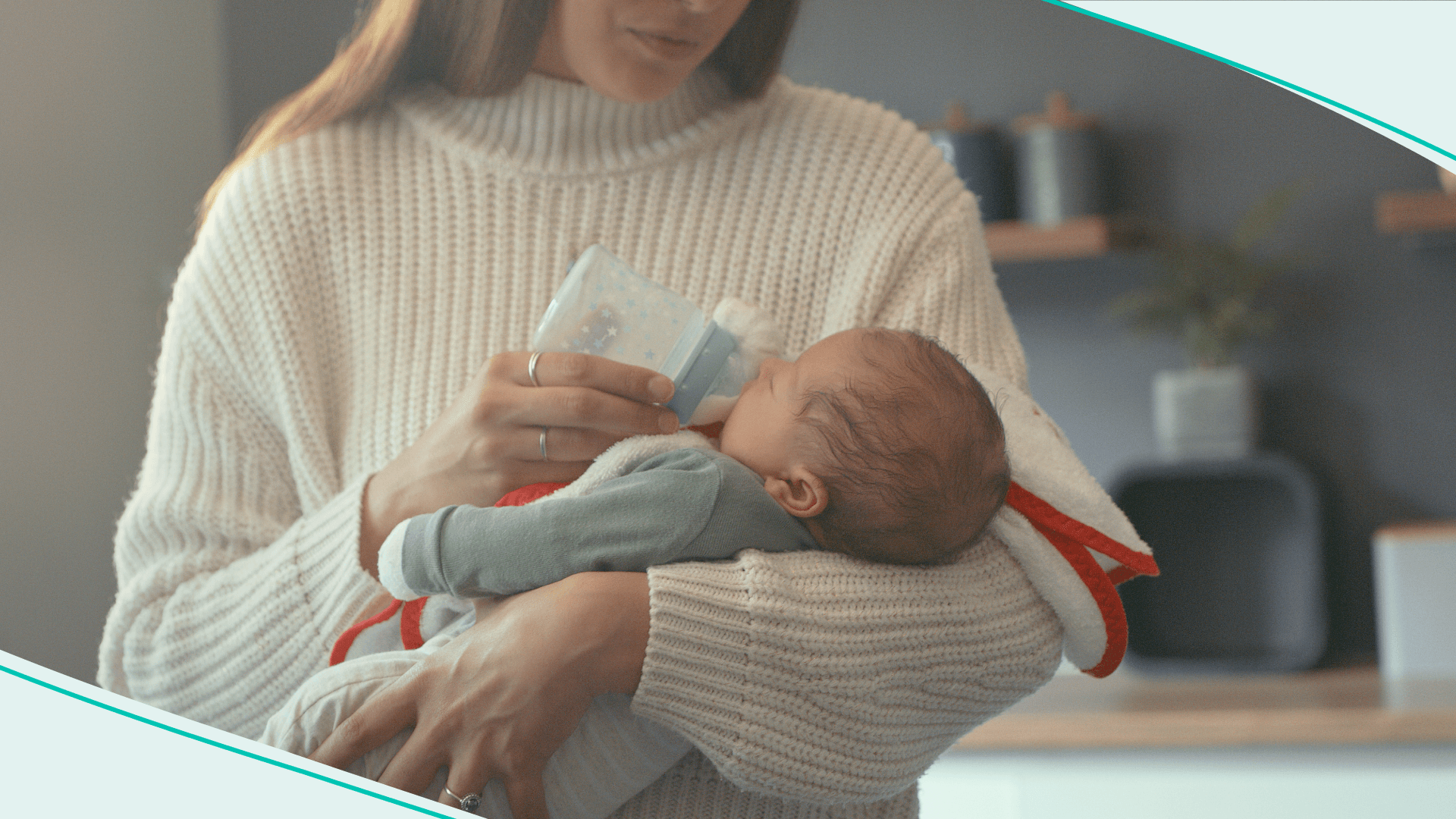 Woman bottle feeding a baby