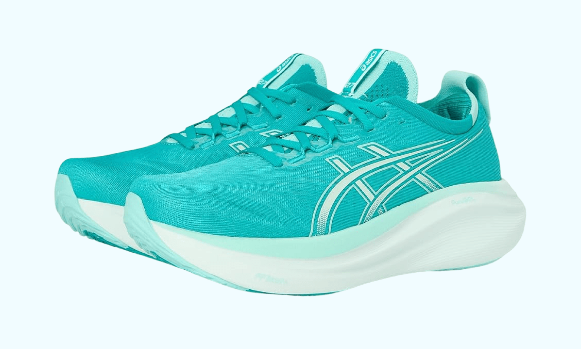 Teal running shoes on light blue background