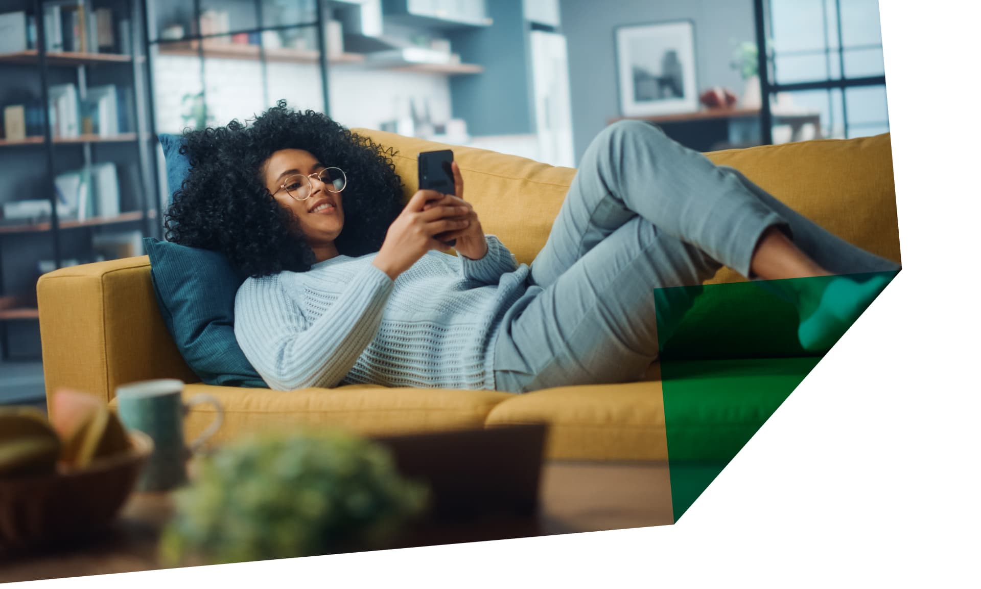 woman on her phone on couch