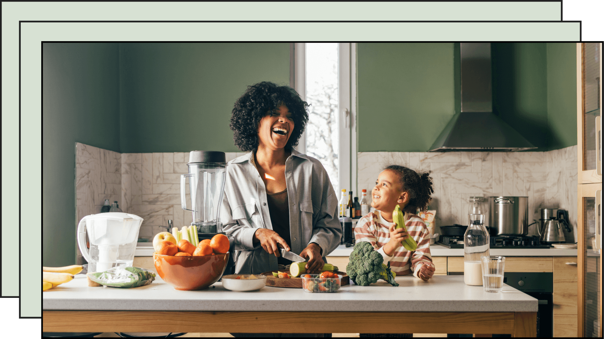 mom and daughter in kitchen laughing